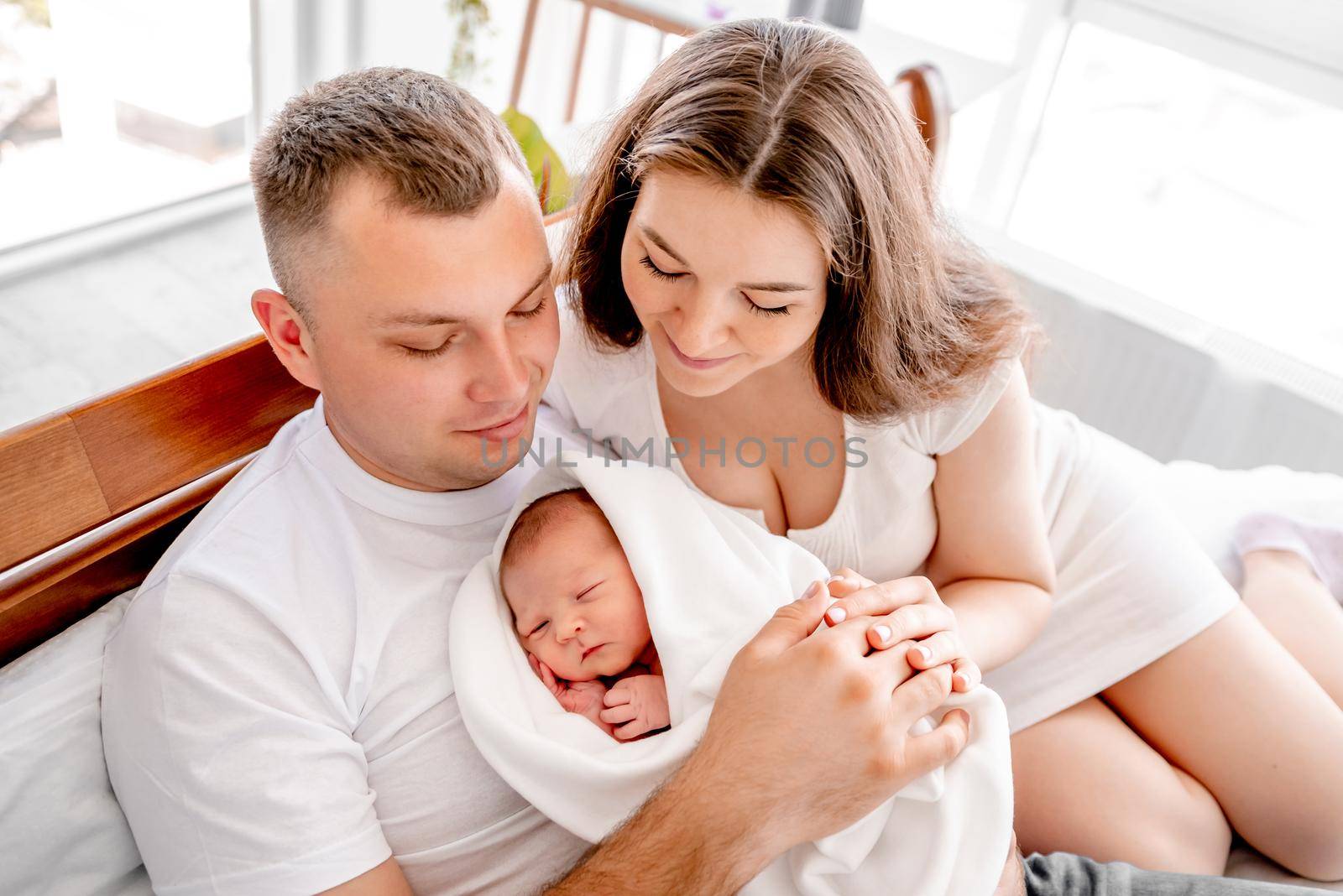 Young family with newborn daughter by tan4ikk1