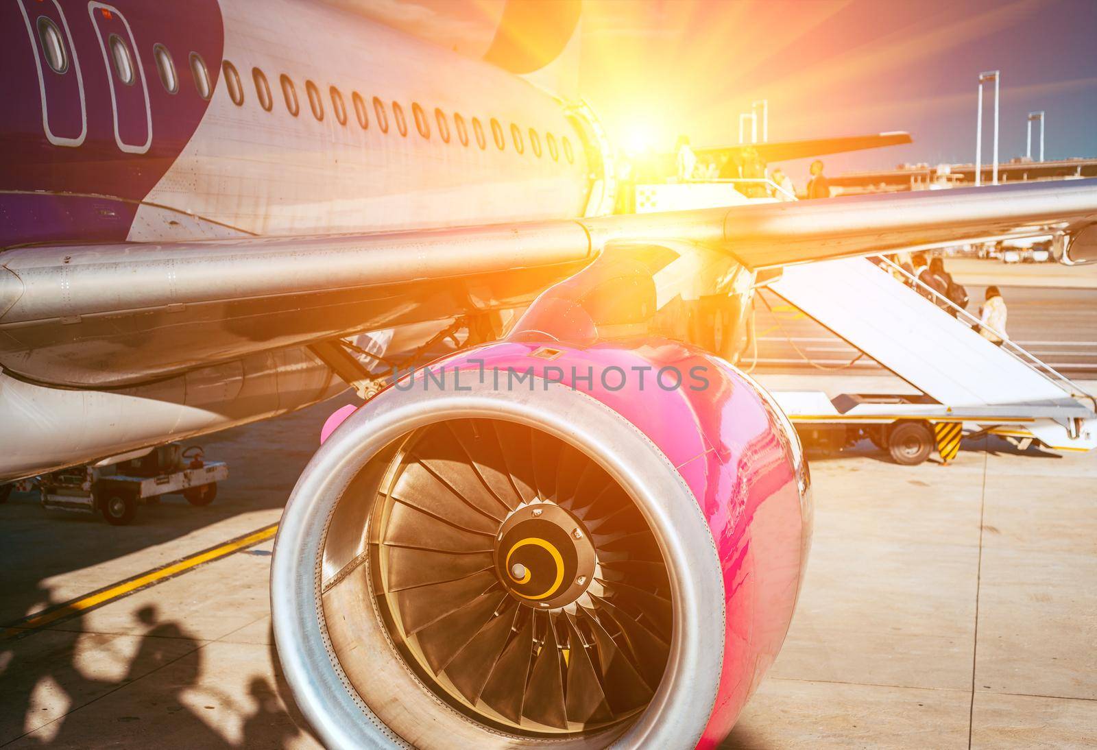 plane and the airport in the setting sun