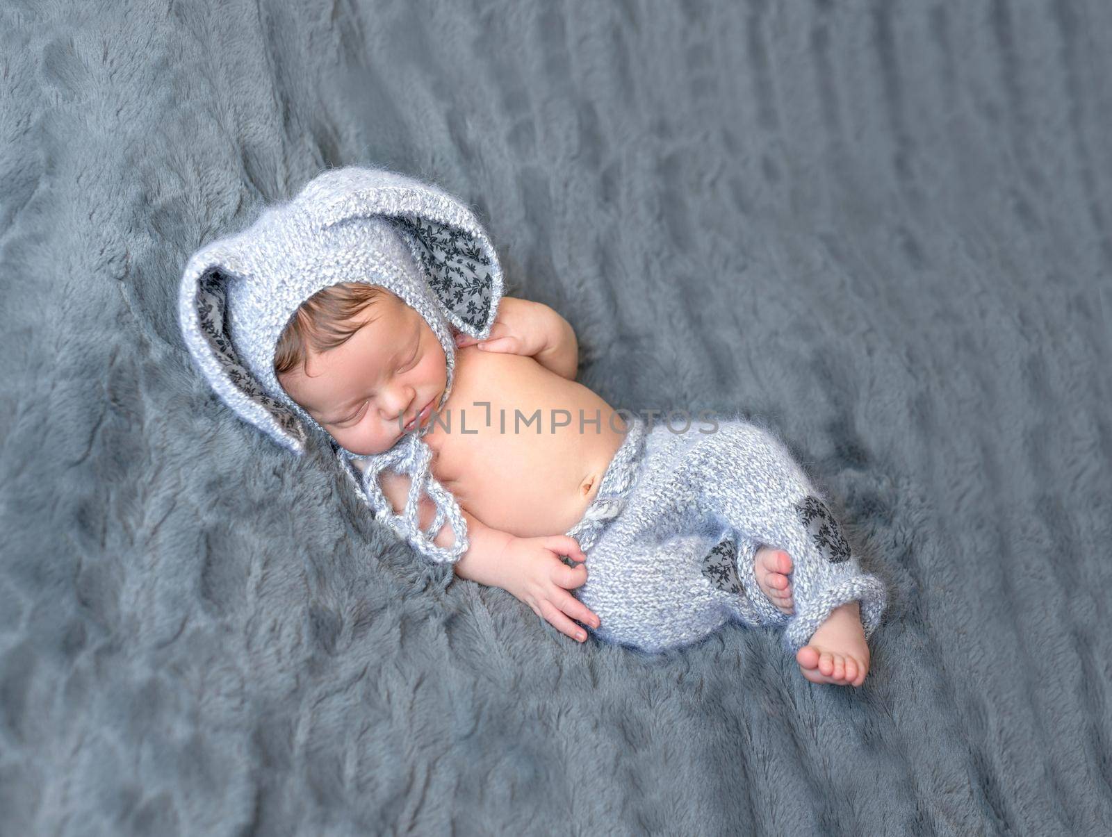 beautiful newborn baby in lovely hat with rabbit ears by tan4ikk1