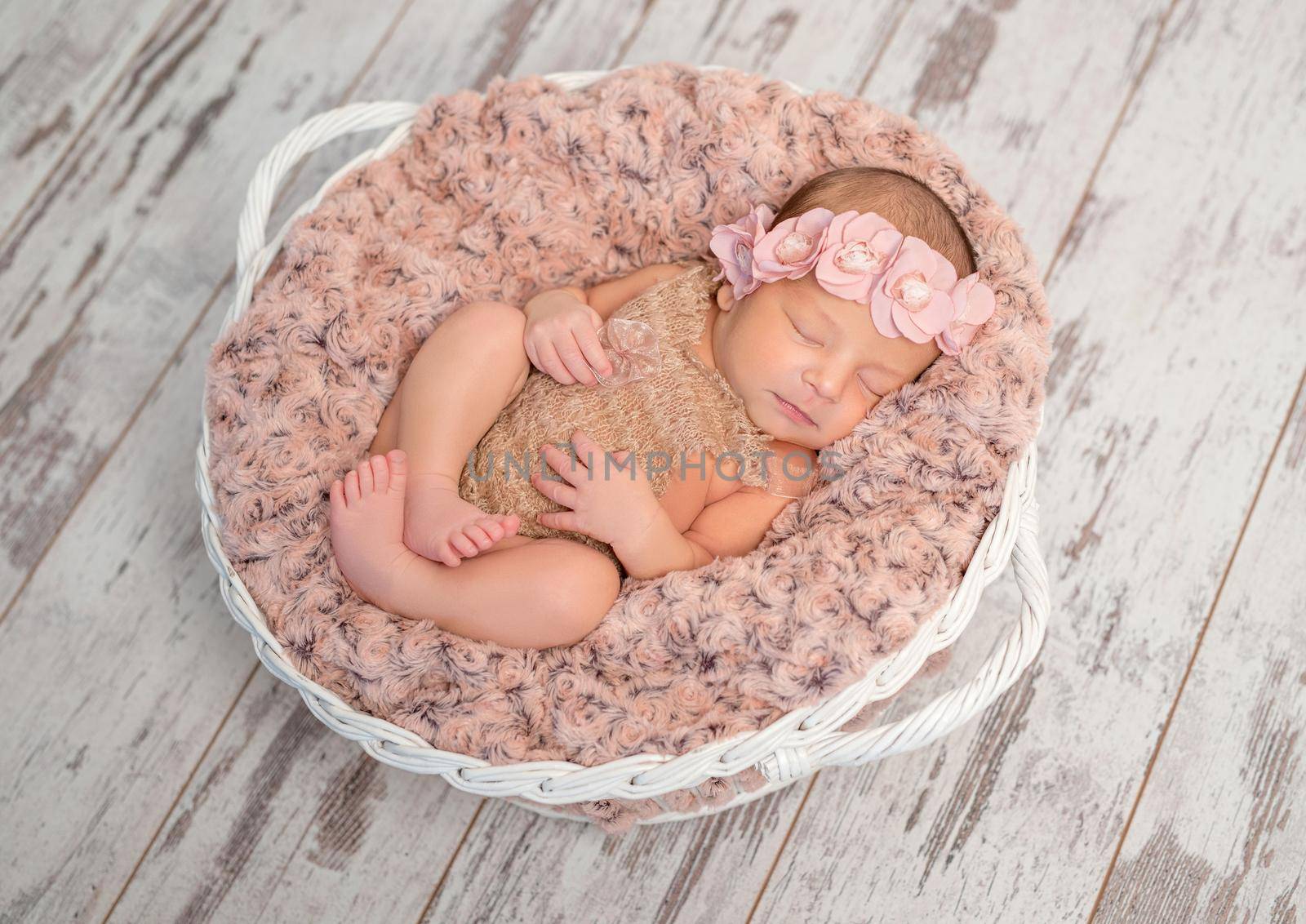 beautiful newborn in basket with fluffy blanket by tan4ikk1