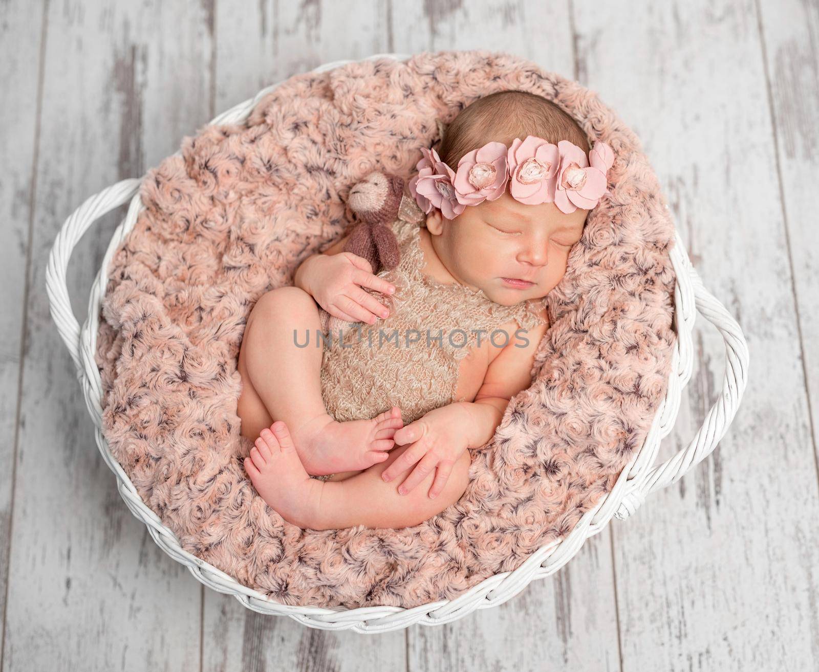 beautiful newborn in basket with fluffy blanket by tan4ikk1