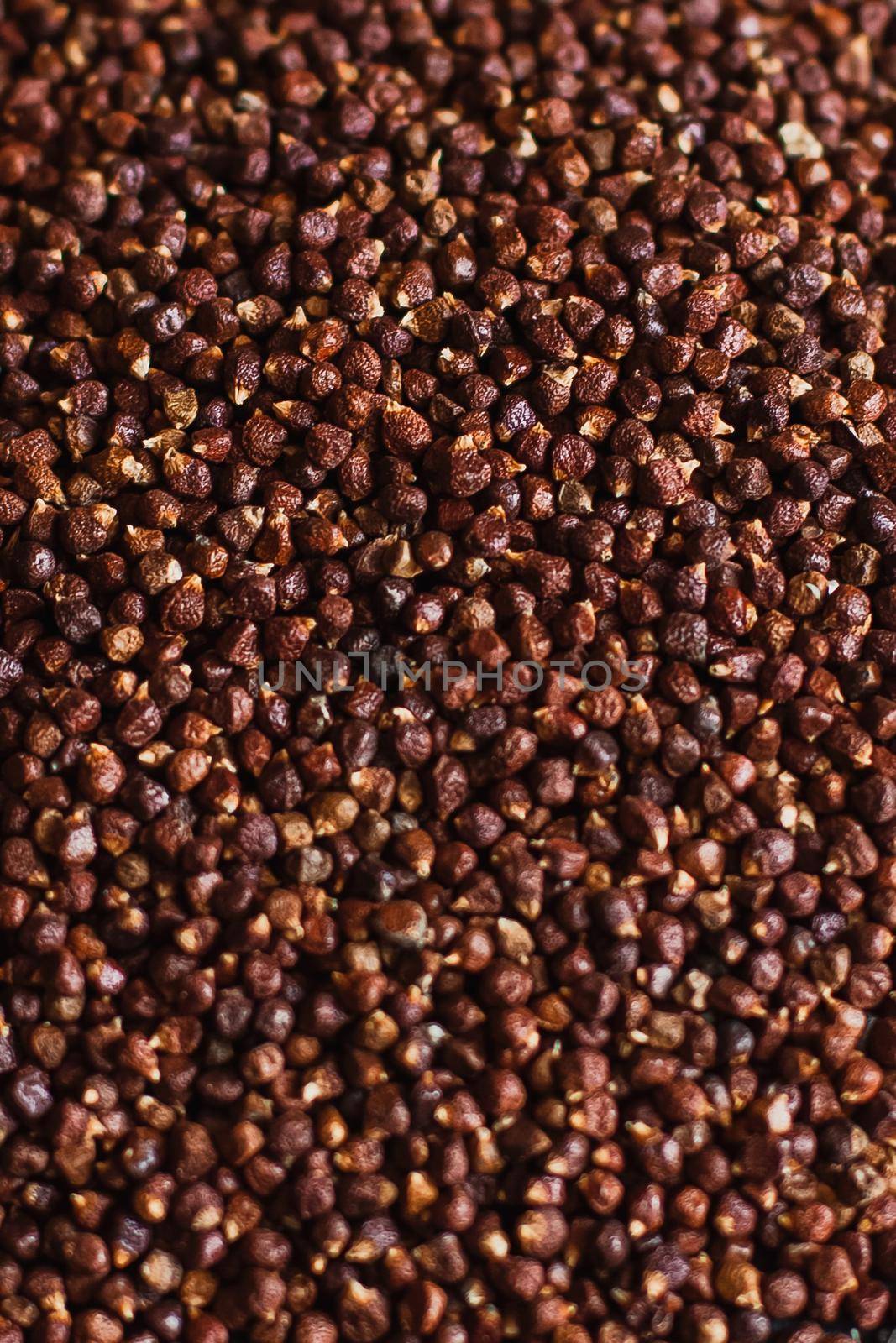 Black pepper grains, peppercorns seeds on a background close up macro by mmp1206