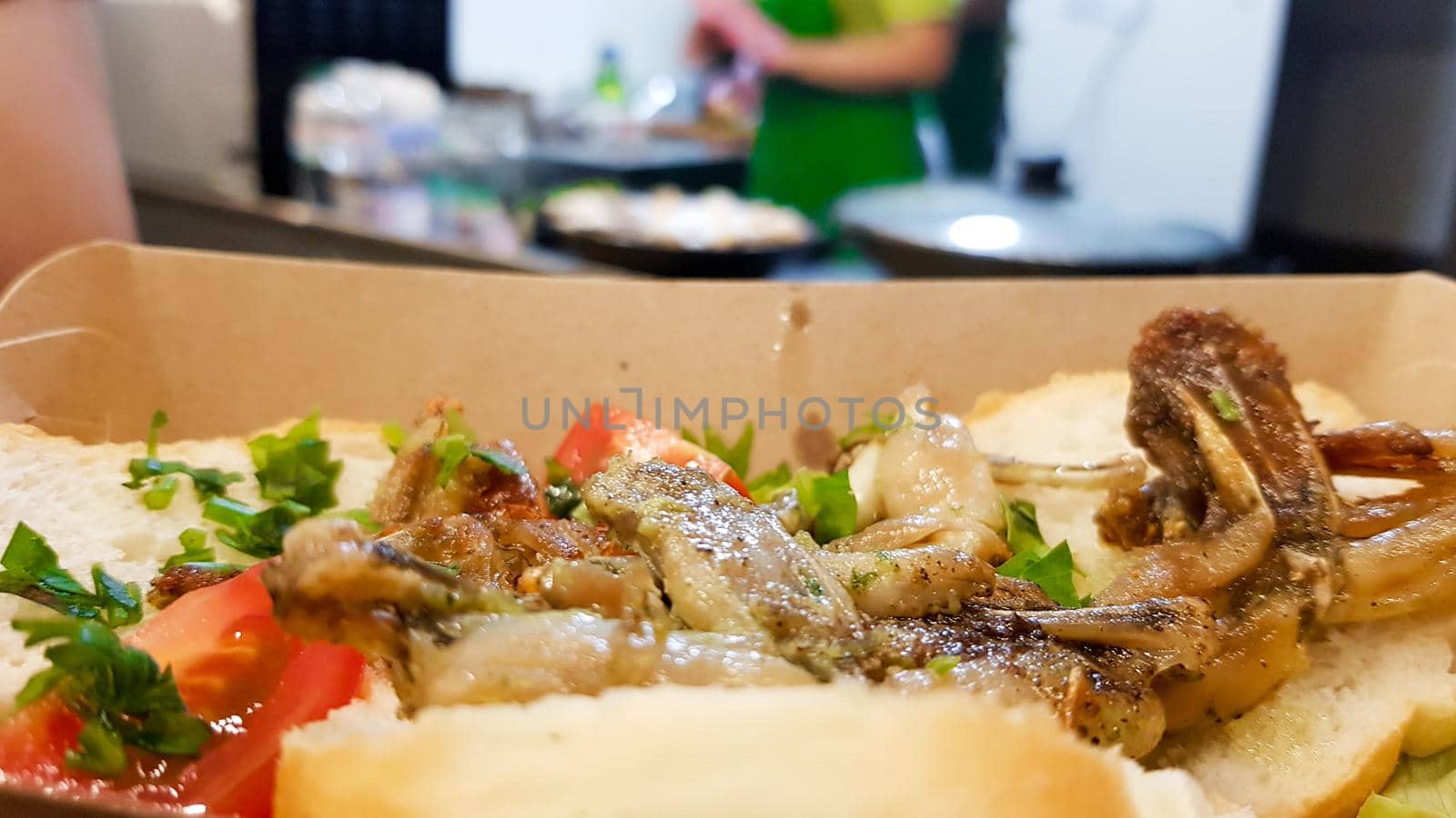 Cambodian dish grilled frog. Tasty exotic dishes are served in the restaurant. Street food frog legs.