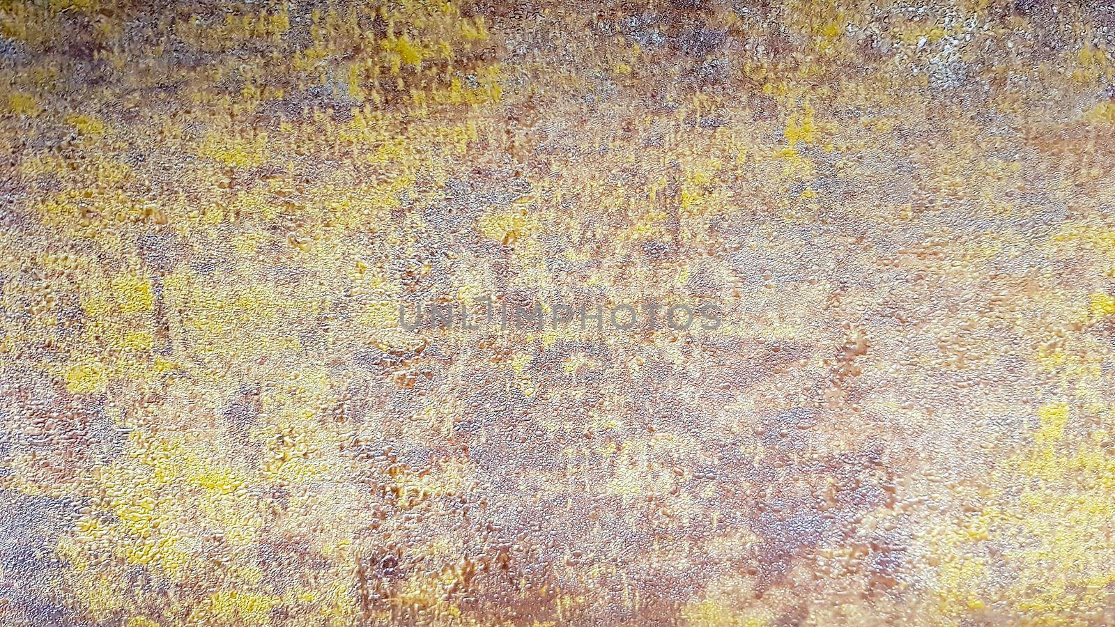 Brown, gray and gold dirty concrete wall plaster texture. Decorative paint for walls or grunge style background. Decorative plaster