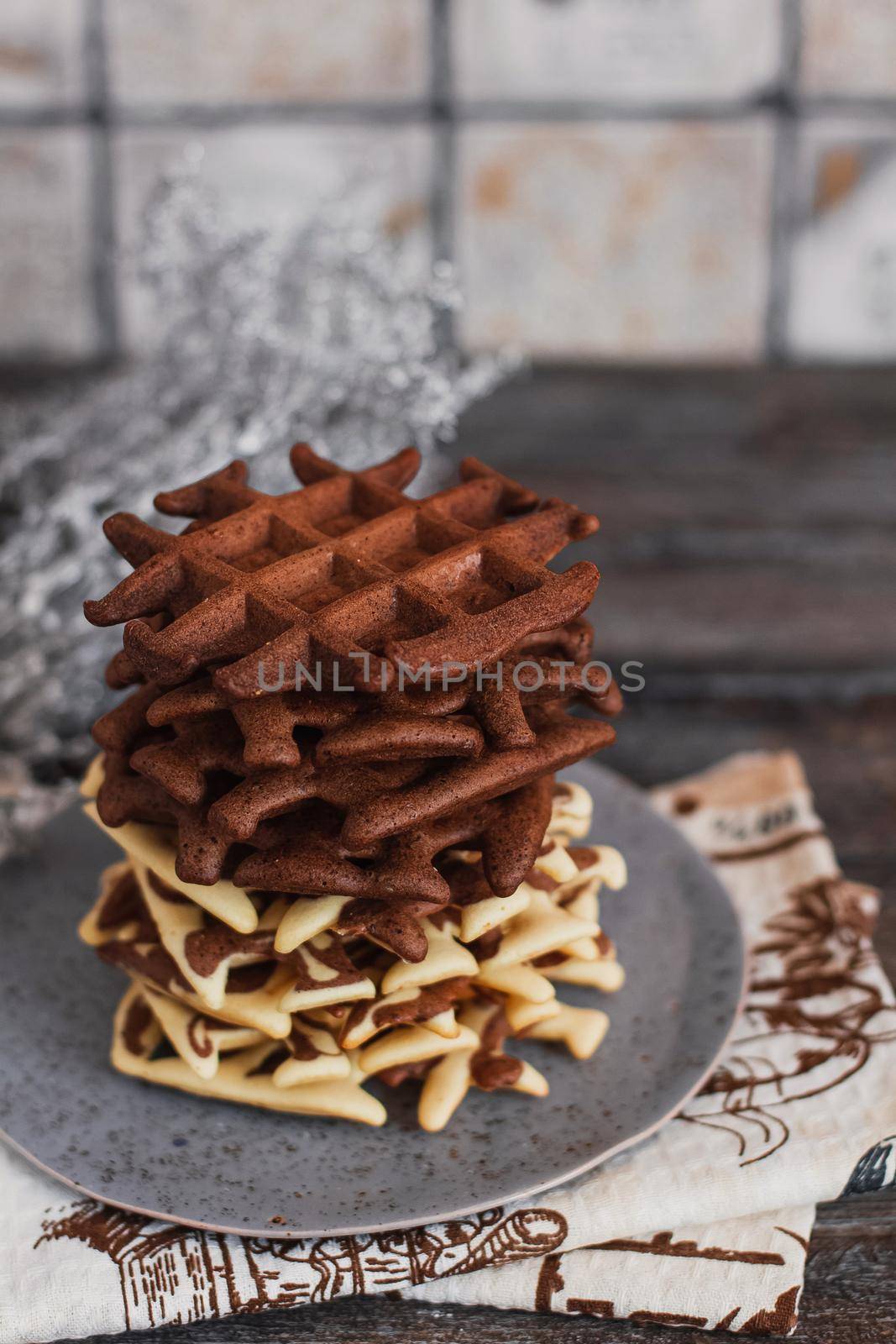 Traditional Belgian waffles with cocoa on wooden background, homemade healthy breakfast. by mmp1206