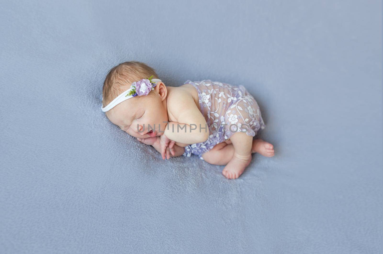 Cute infant sleeping covered with purple veil by tan4ikk1