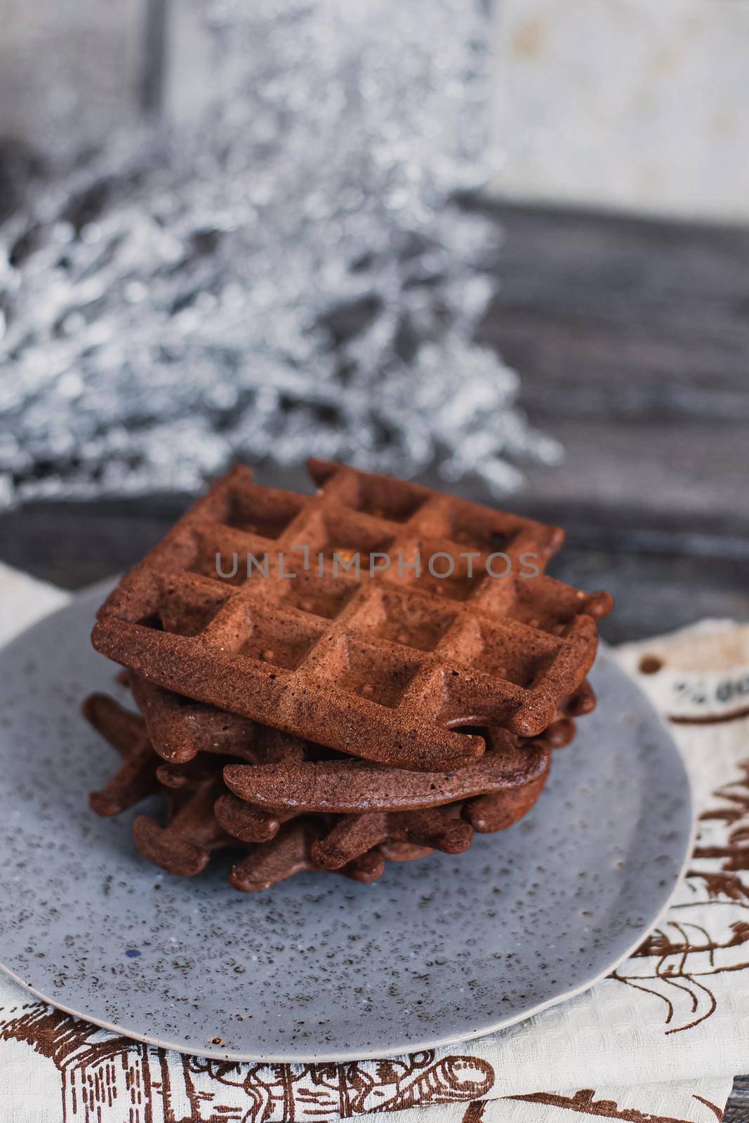 Traditional Belgian waffles with cocoa on wooden background, homemade healthy breakfast. by mmp1206