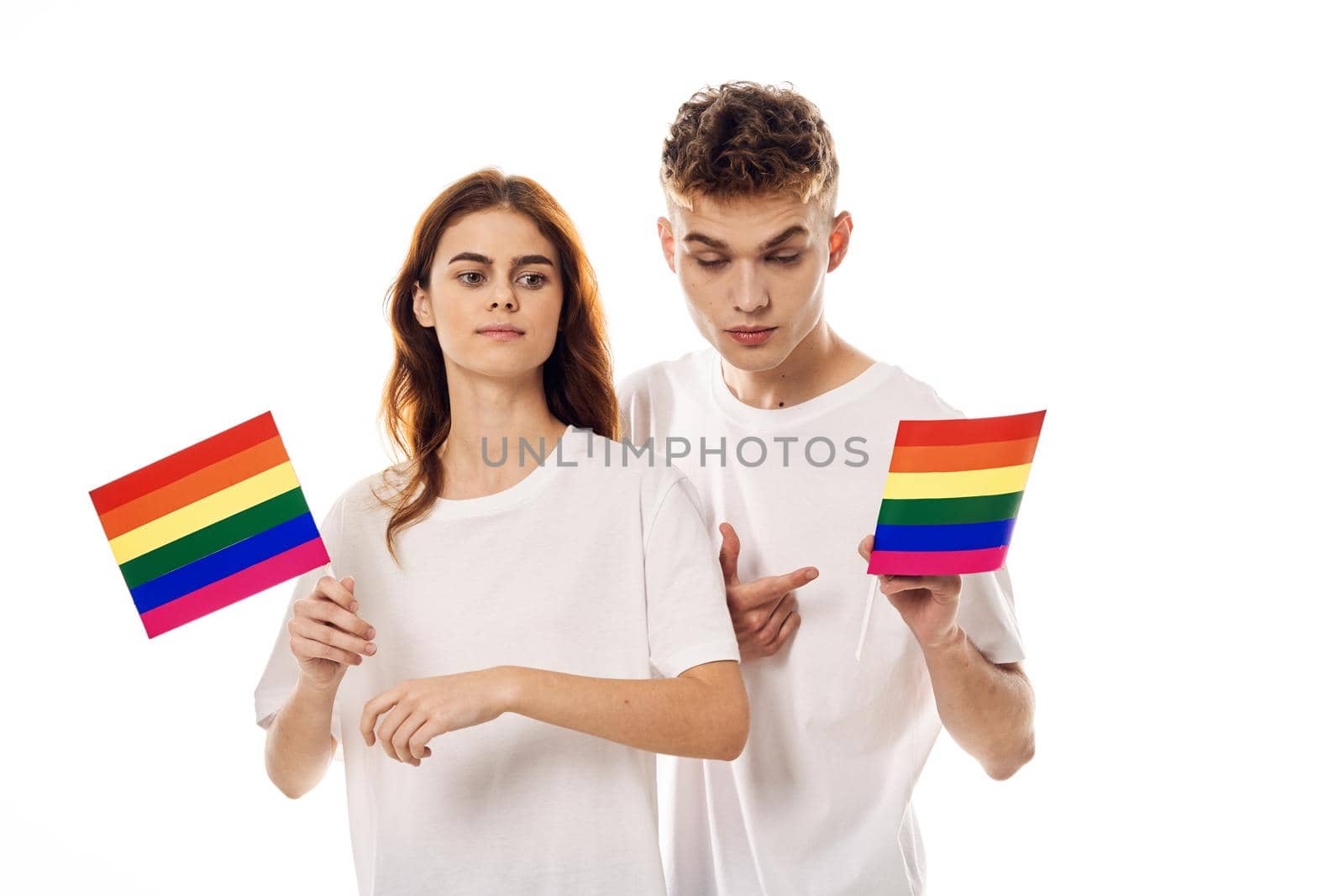 young couple in white t-shirts Flag lgbt transgender sexual minorities by Vichizh