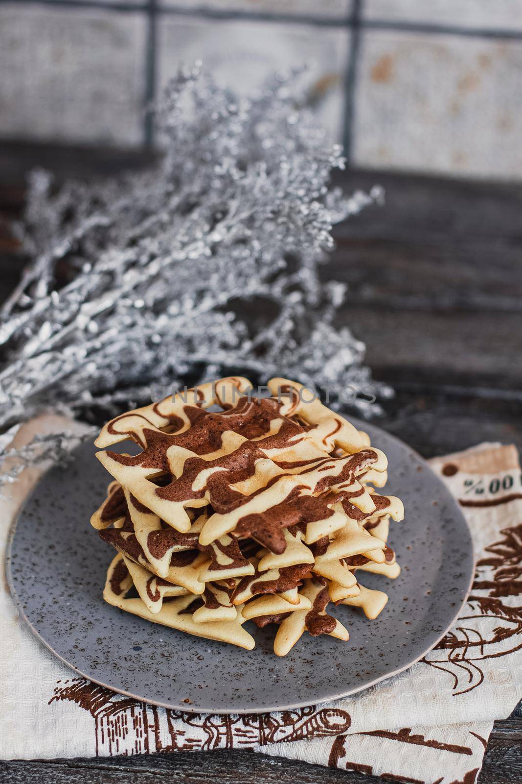 Traditional Belgian waffles with cocoa on wooden background, homemade healthy breakfast