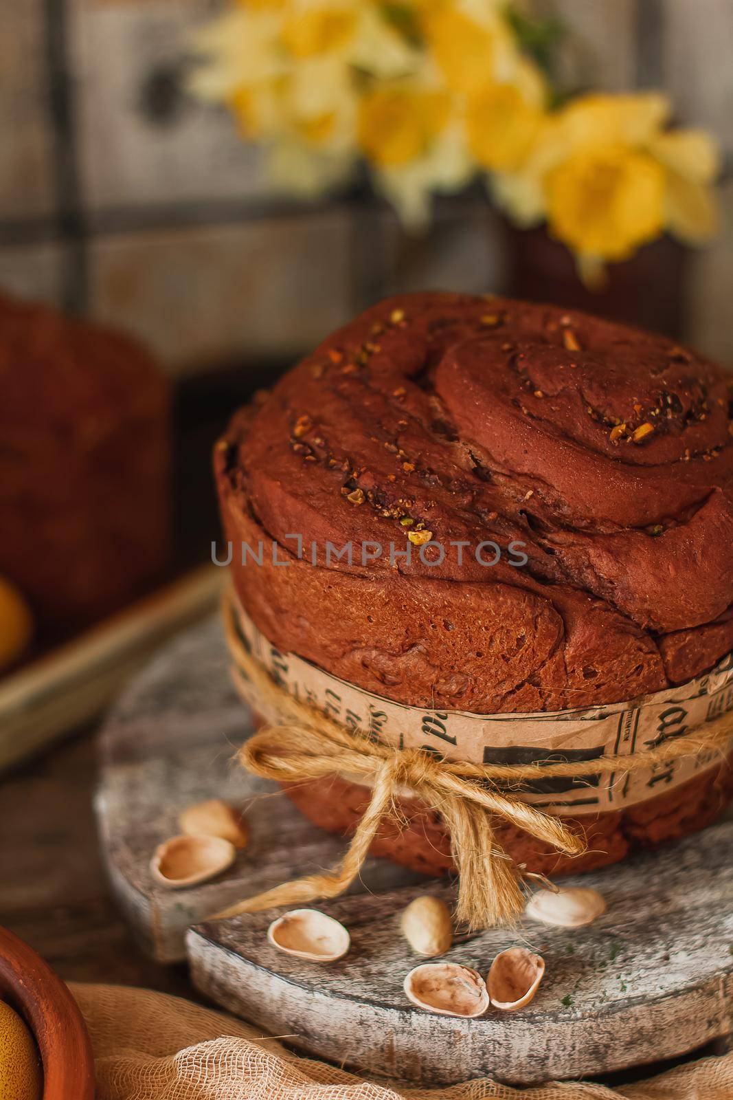 Kulich cake with yellow daffodil flowers, and painted eggs symbol of Traditional Russian Orthodox Easter by mmp1206