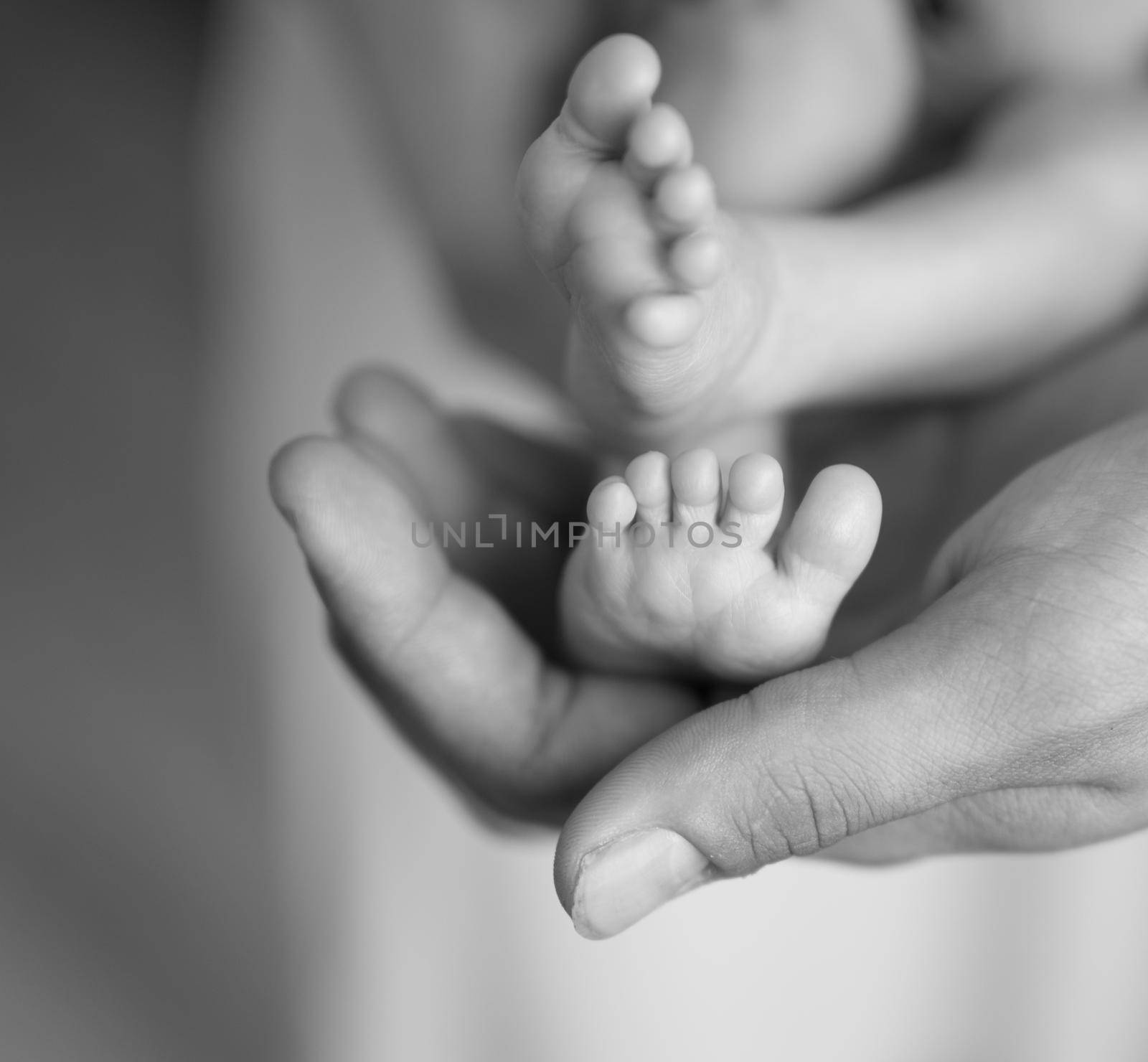 tiny newborn feet in human palm by tan4ikk1