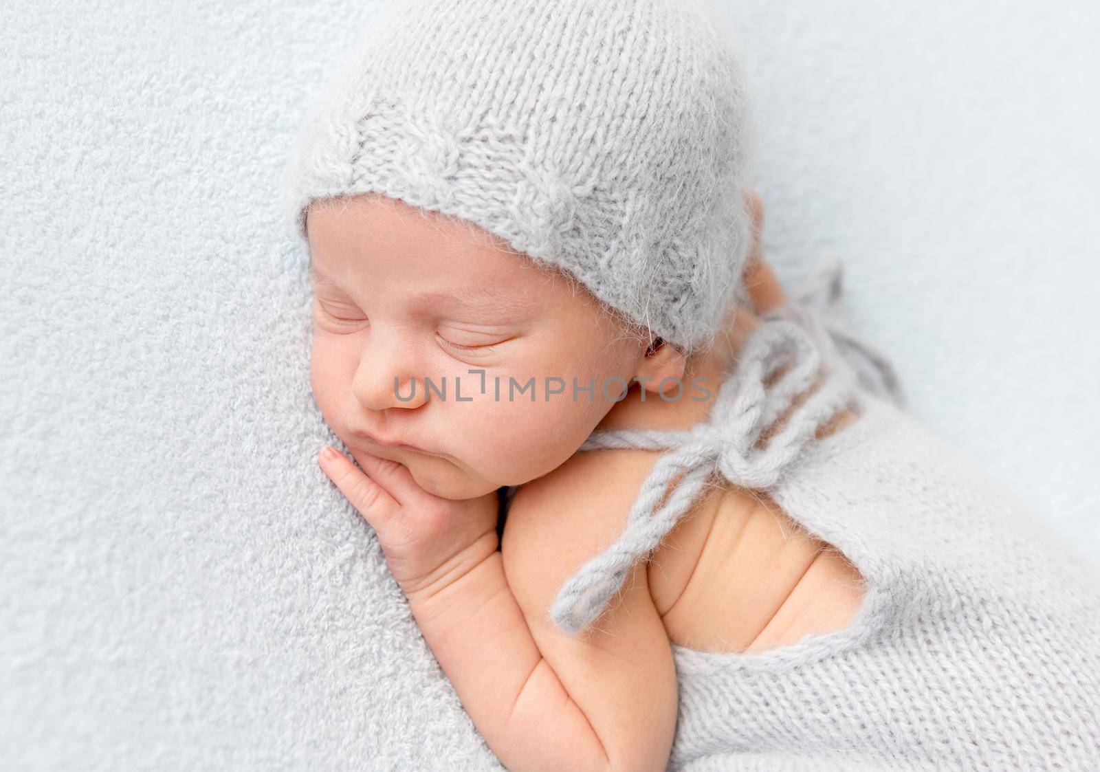 Tender newborn sleeping on belly by tan4ikk1