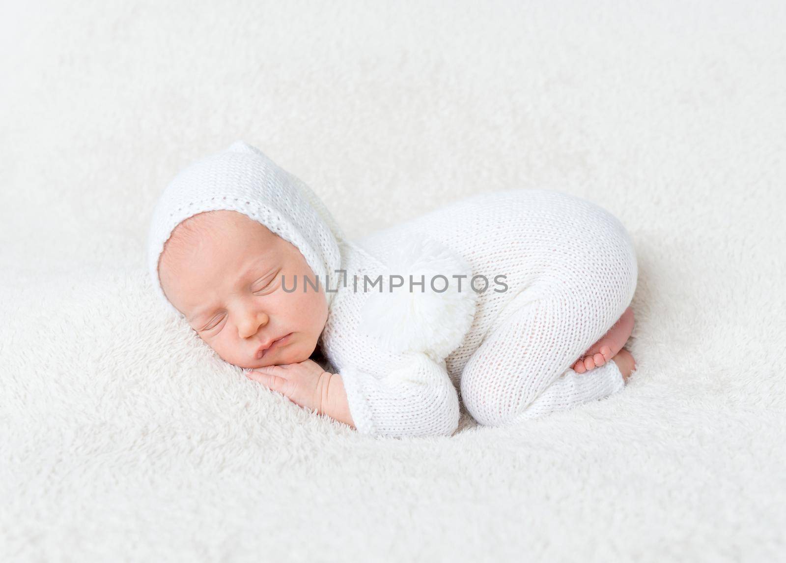 Infant boy in white bodysuit by tan4ikk1