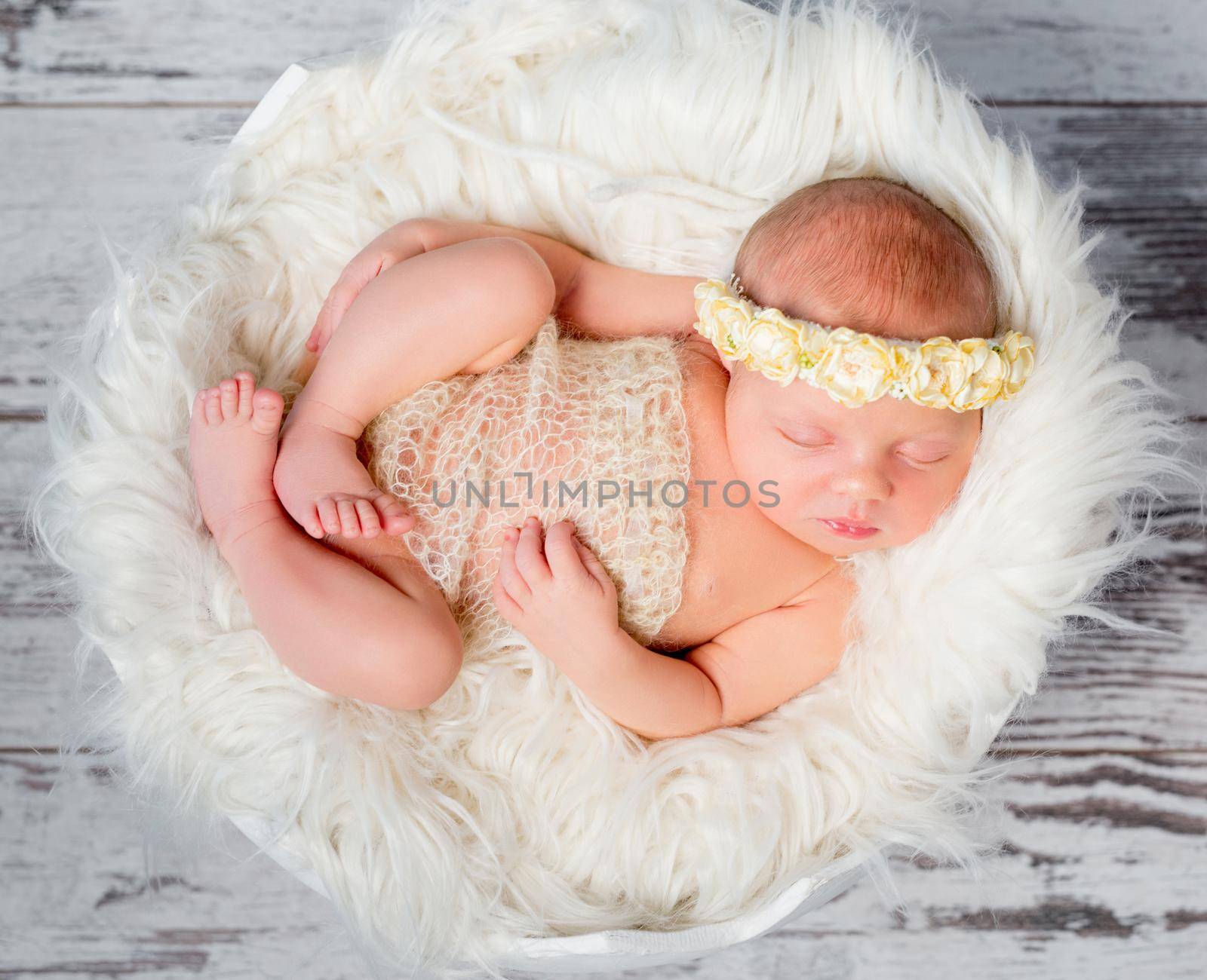 sleeping newborn girl on round bed in funy pose by tan4ikk1