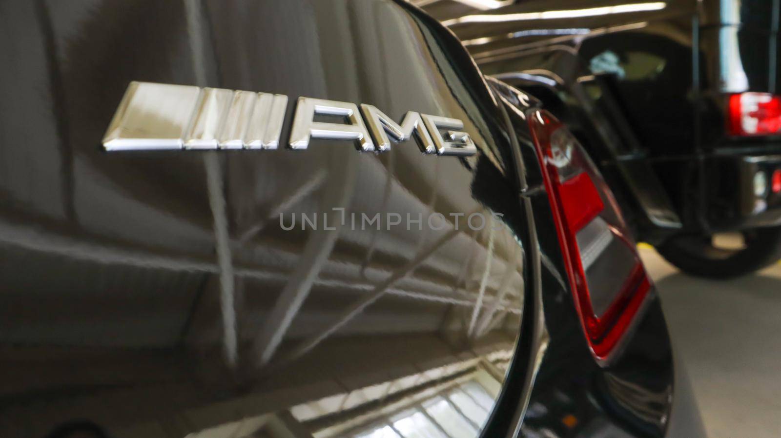 Mercedes Benz SLS amg Roadster, 2012. Double luxury supercar in the back of a coupe. The sports car is equipped with a 6.2 L V8 M159 engine. Ukraine, Kiev - June 09, 2021