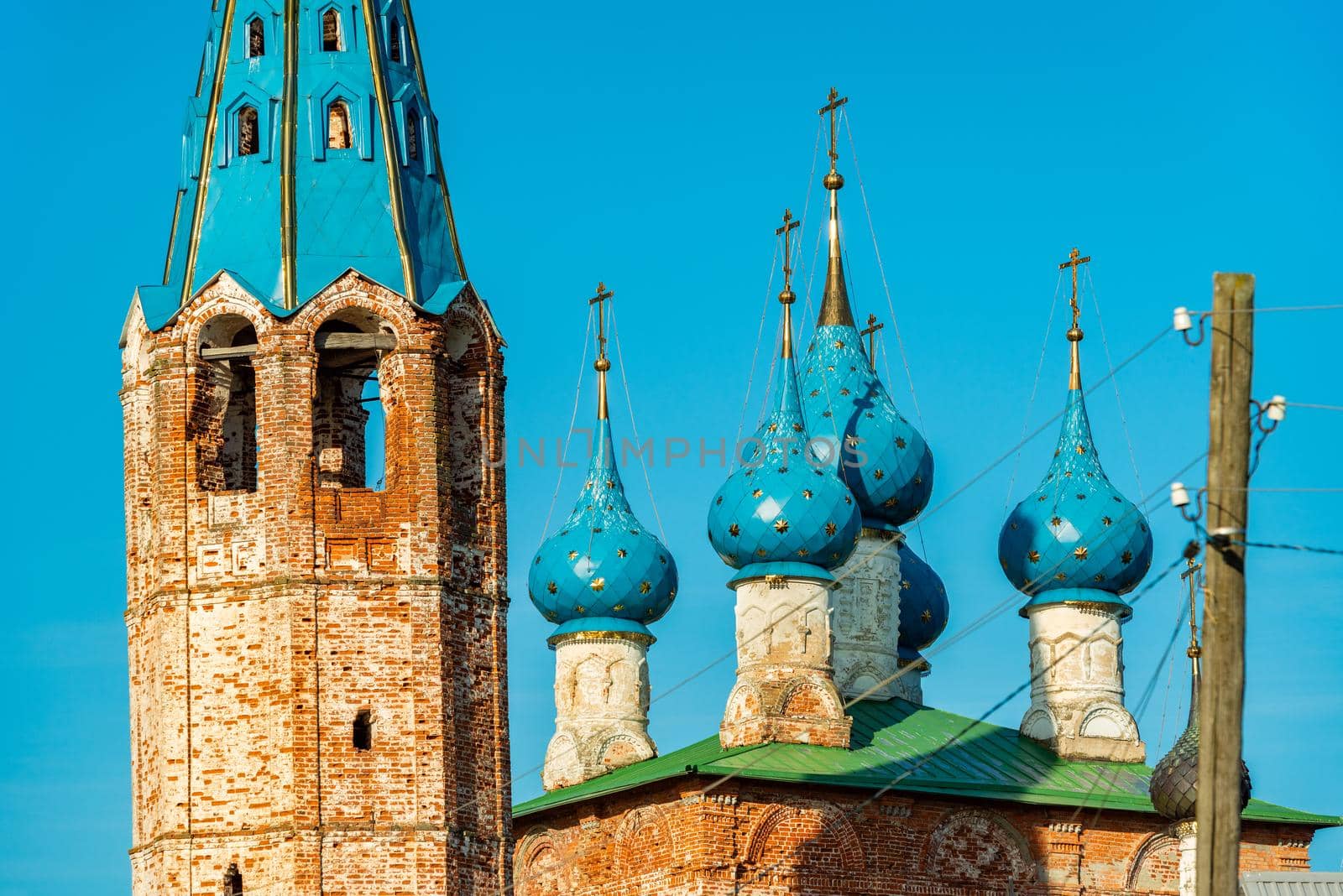 Dunilovo - September 2020, Russia: View of the domes and tower of the Annunciation Church and Church of the Theotokos of Kazan