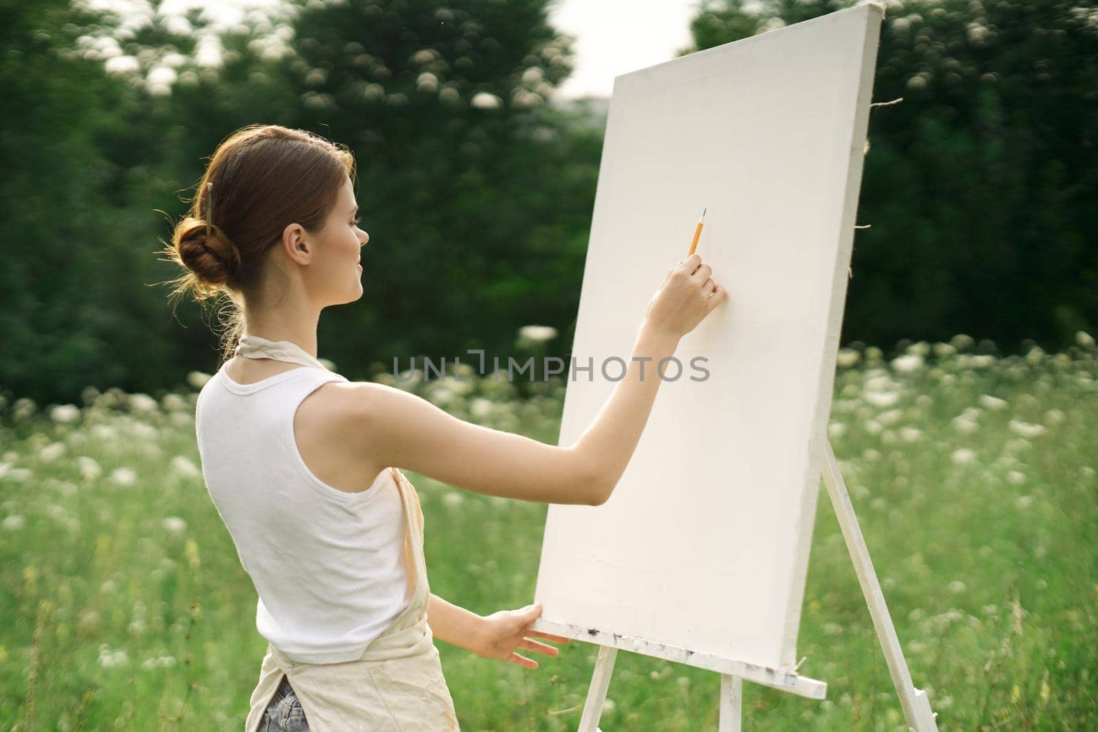 woman artist creative drawing landscape nature hobby. High quality photo