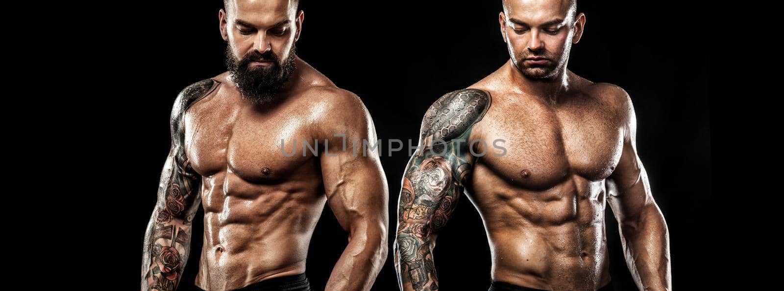 Tattoo man bodybuilder. Action shot with copy space.