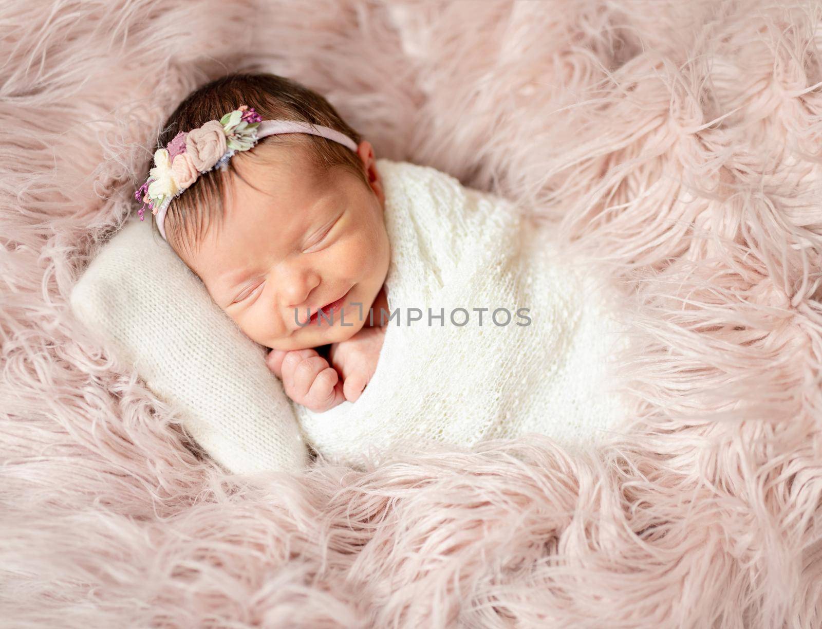 Little cutie infant girl sleeping on baby bed