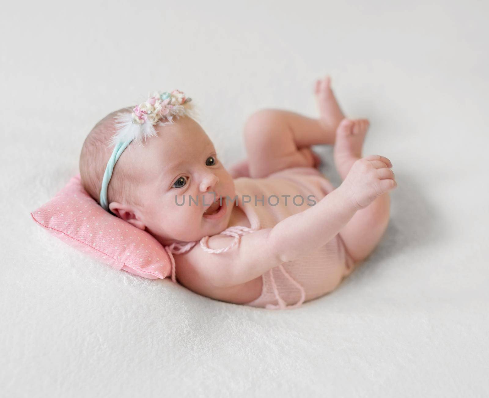 Little smiling baby joyfully lying by tan4ikk1