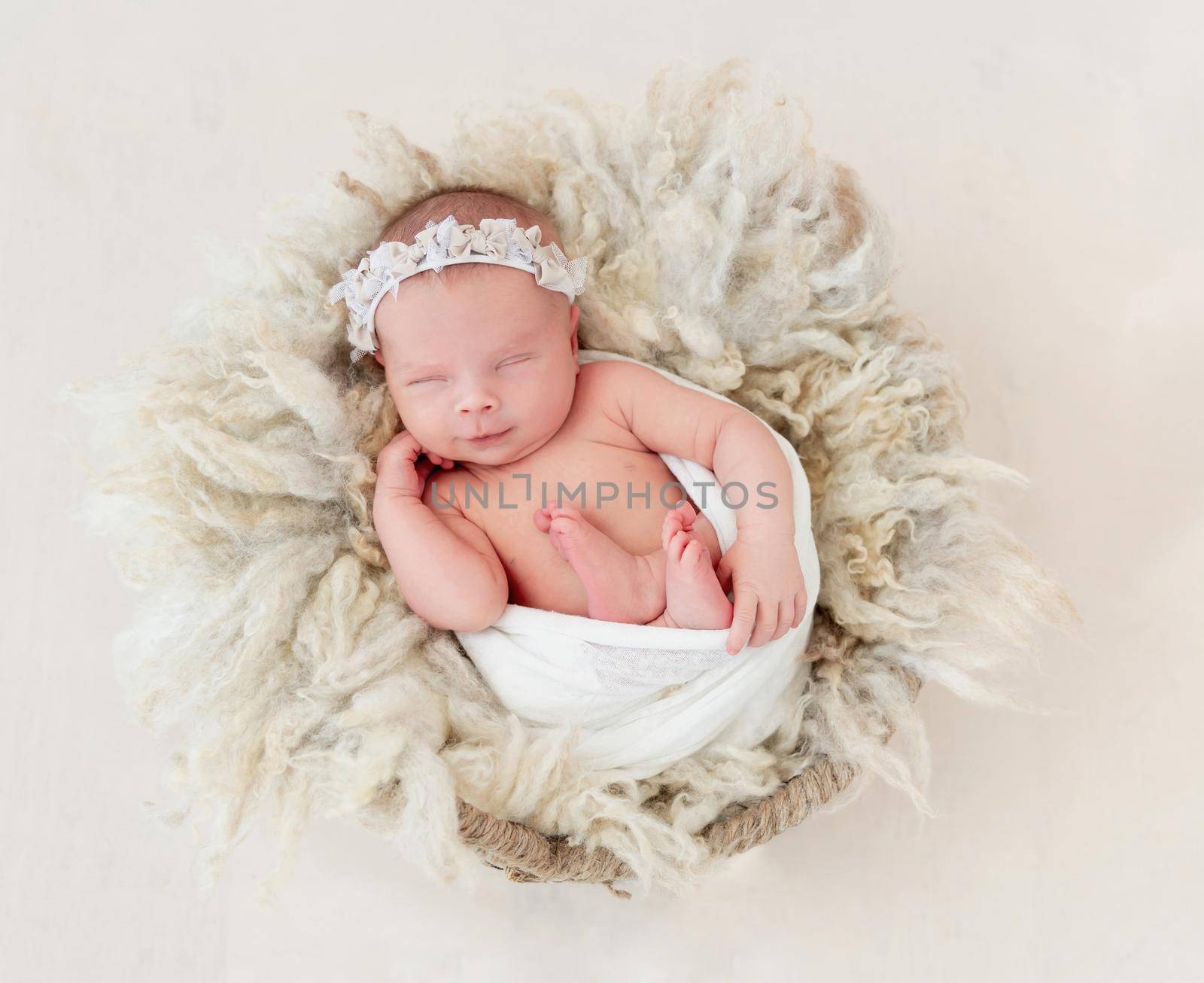 newborn baby girl sleeping sweetly in the basket