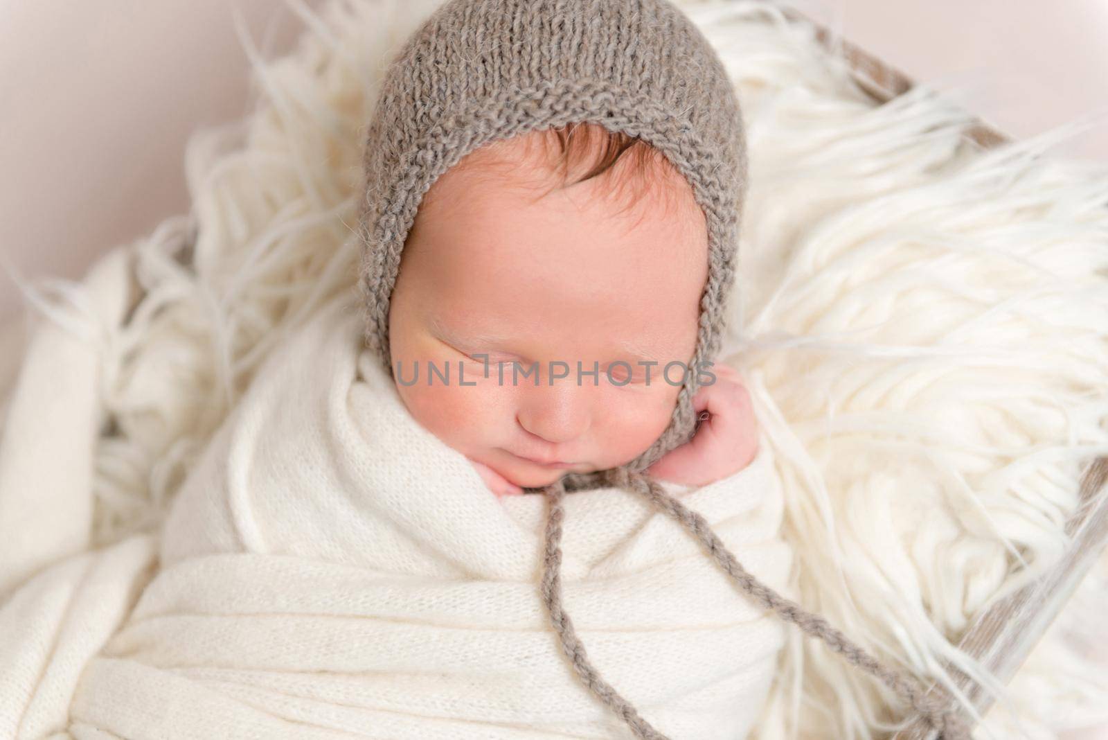 infant with gray hat on napping, closeup by tan4ikk1