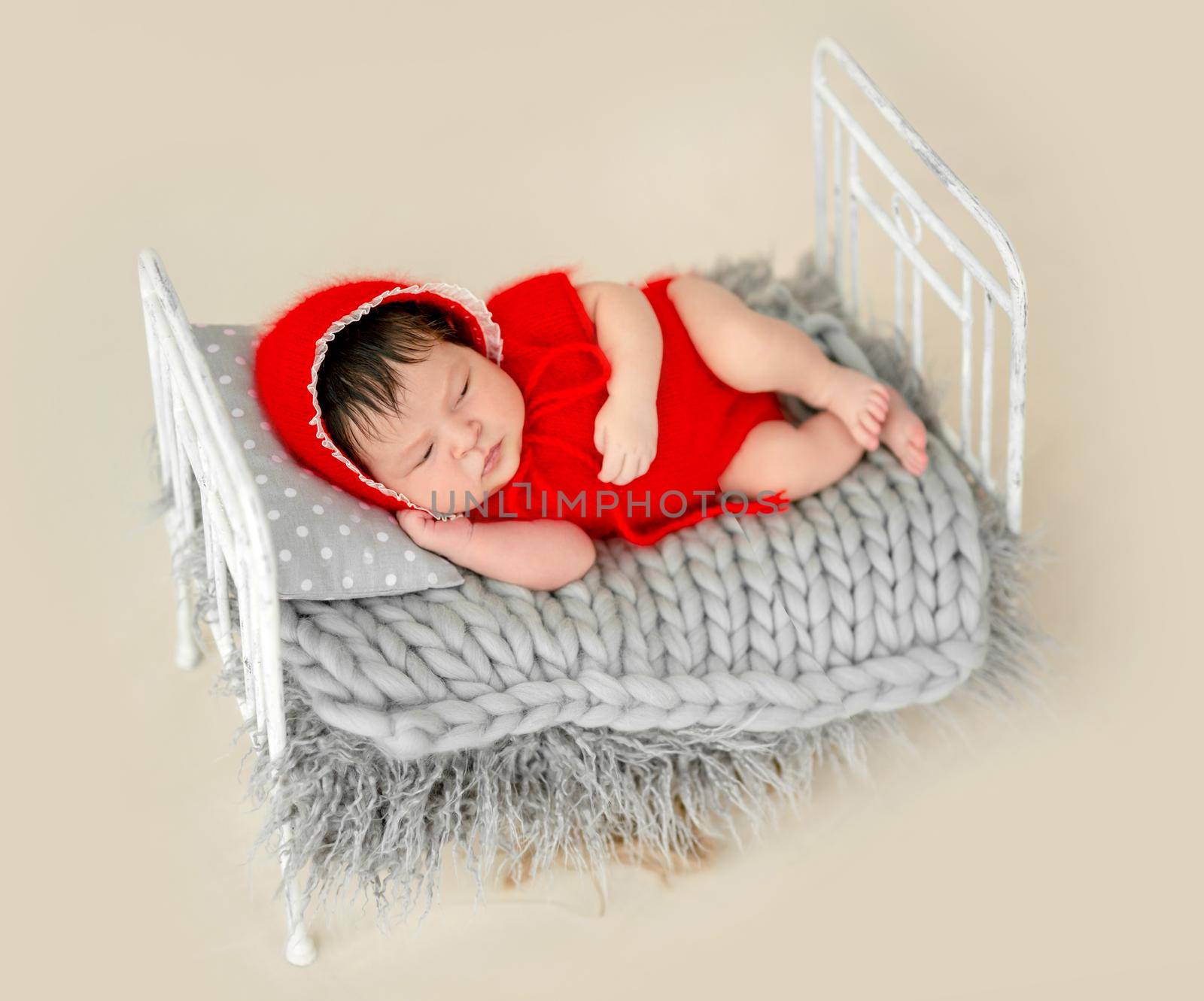 newborn baby girl sleeping in a little bed by tan4ikk1