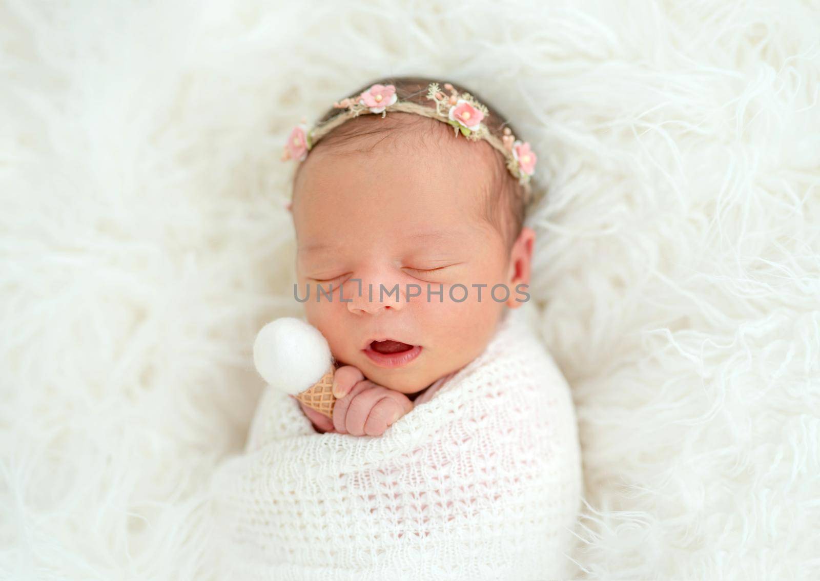 newborn baby girl sleeping sweetly in the basket