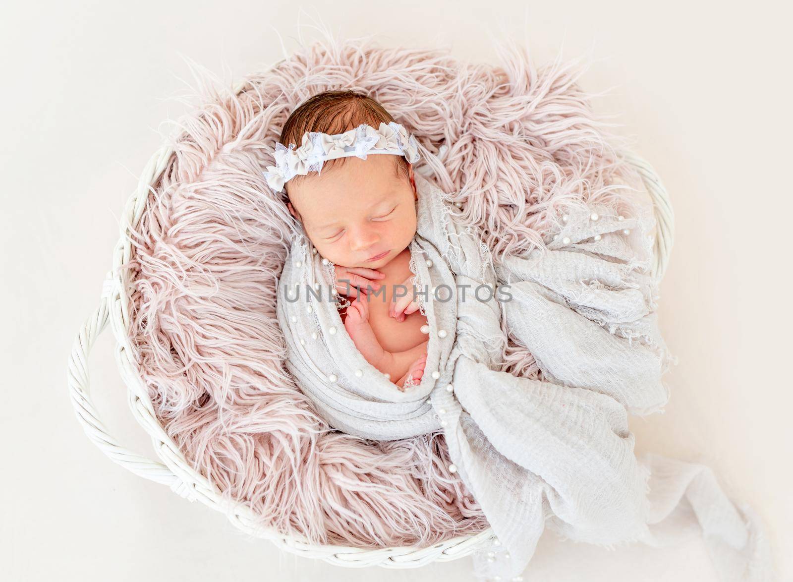 newborn baby girl sleeping sweetly in the basket