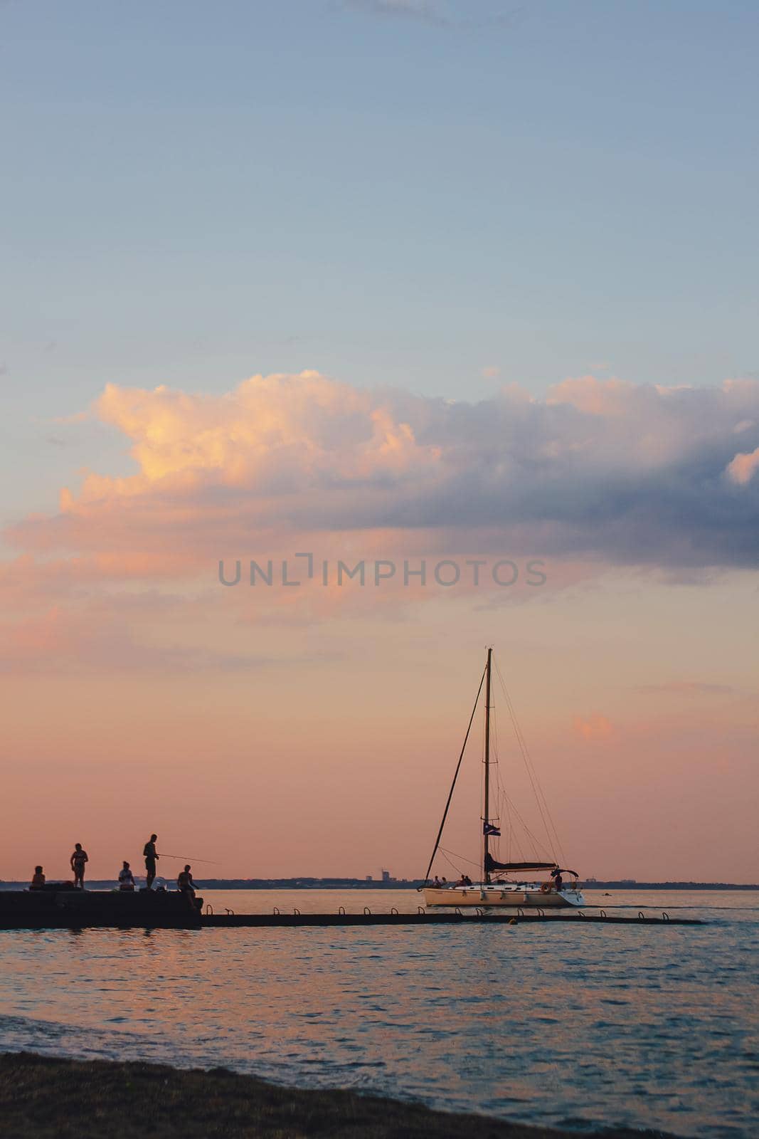 Yacht sailing against sunset. Holiday lifestyle landscape with skyline sailboat and two seagull. Yachting tourism - maritime evening walk. Romantic trip on luxury yacht during the sea sunset by mmp1206