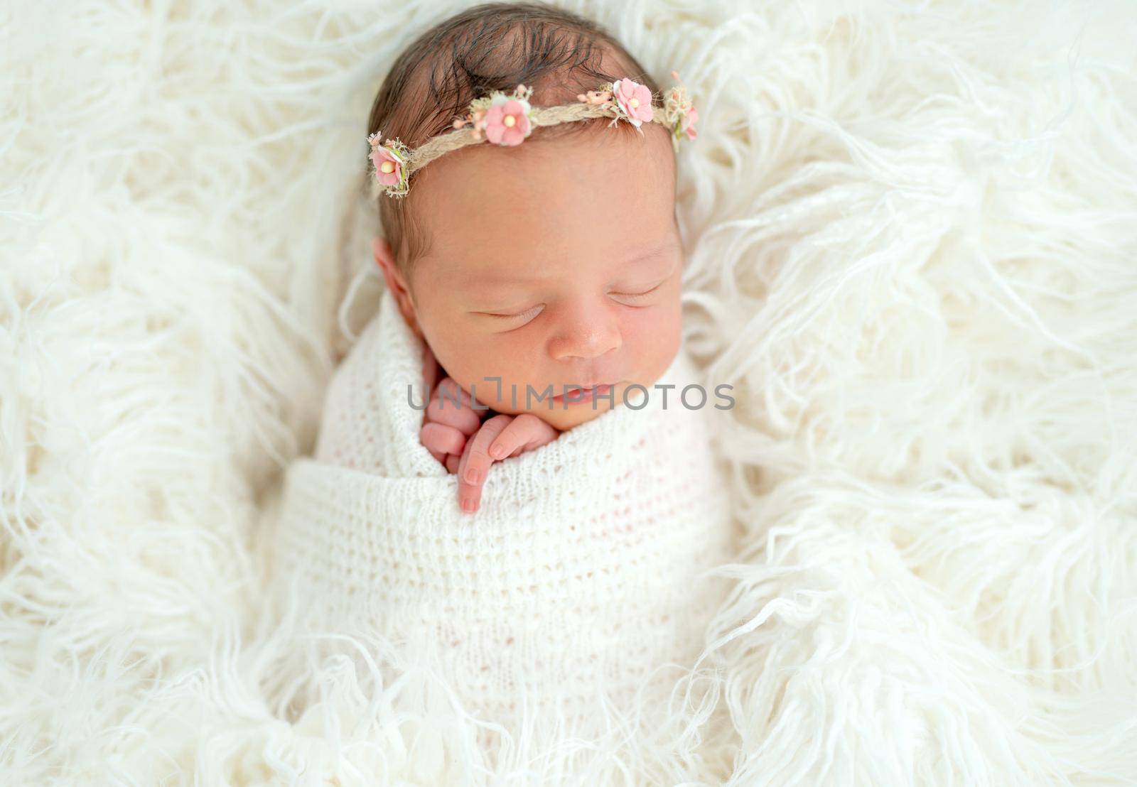 newborn baby girl sleeping sweetly in the basket