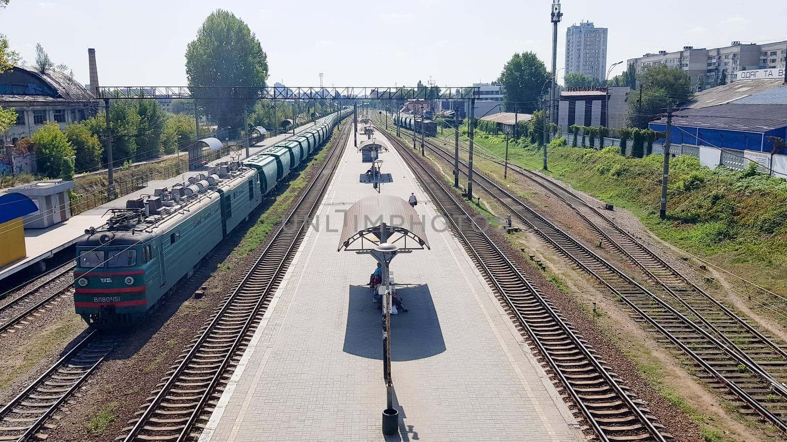 Ukraine, Kiev - June 16, 2019: Station with trains. The train stands at the railway station waiting for passengers in the daytime. Panorama, view from the bridge.