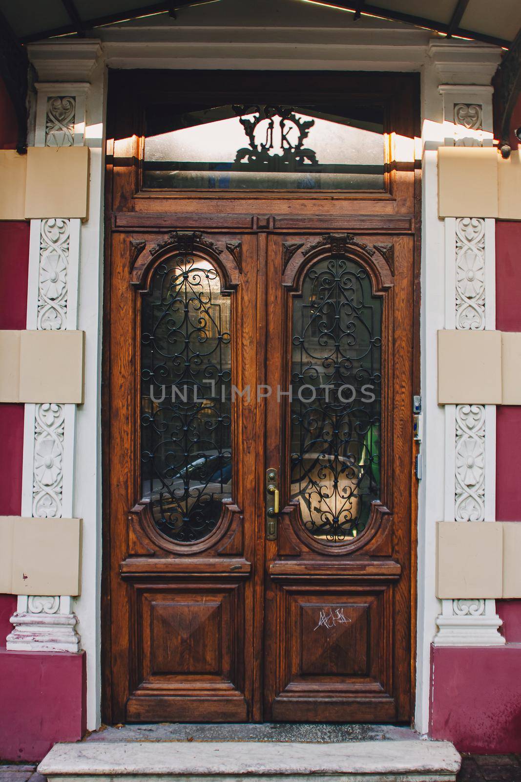 Old wooden weathered door in ancient town architecture