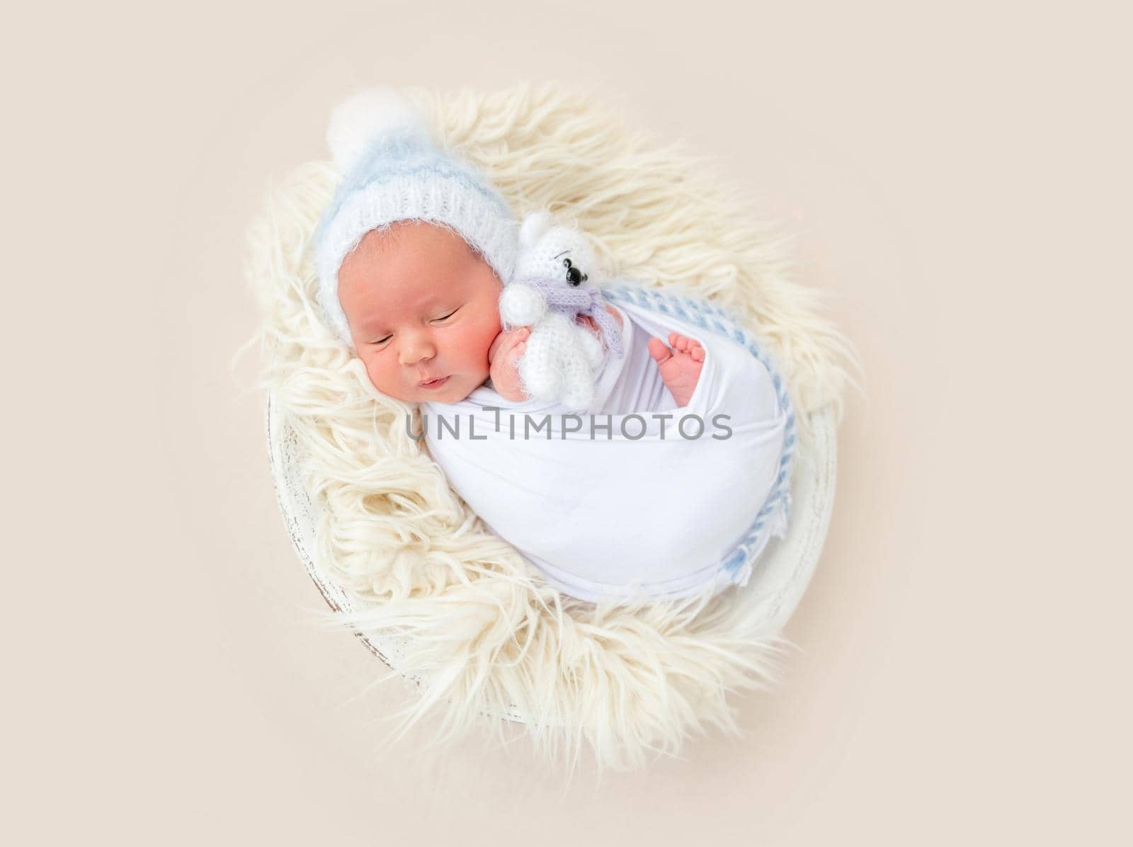 Charming wrapped up newborn lying awake