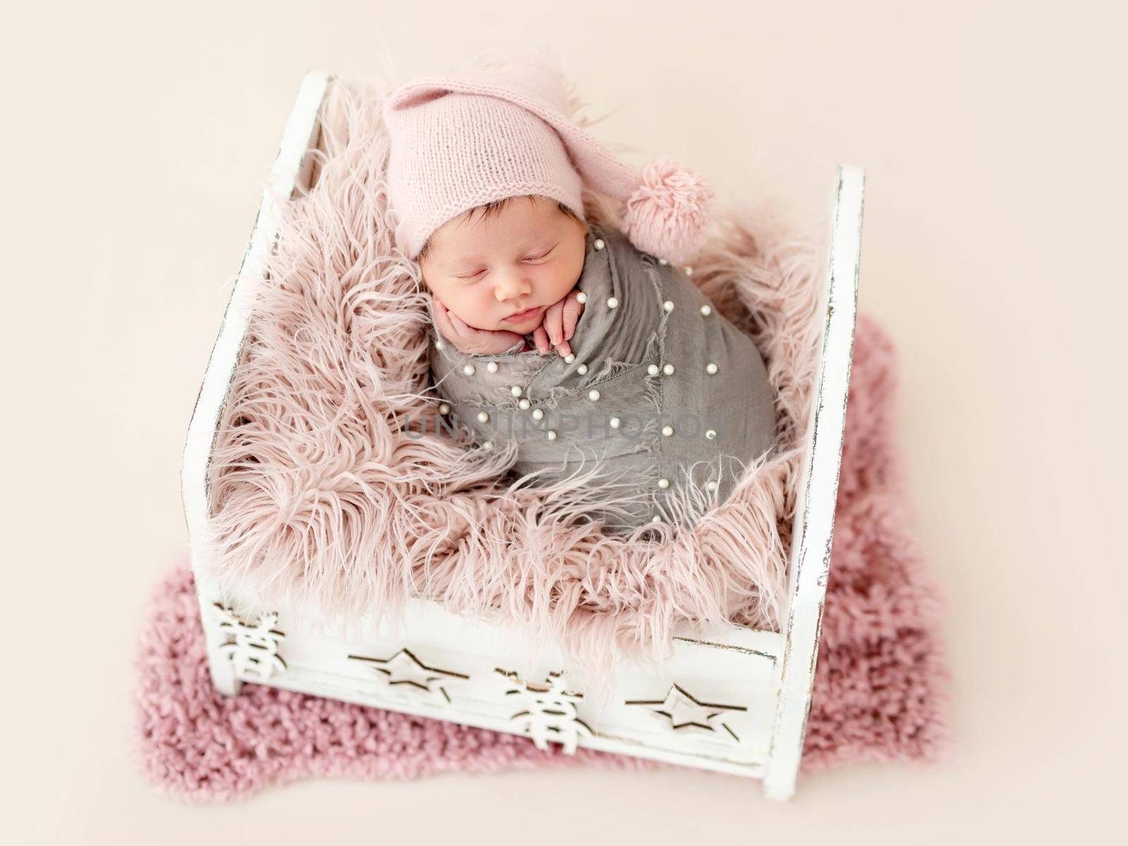Sweet newborn sleeping in cradle
