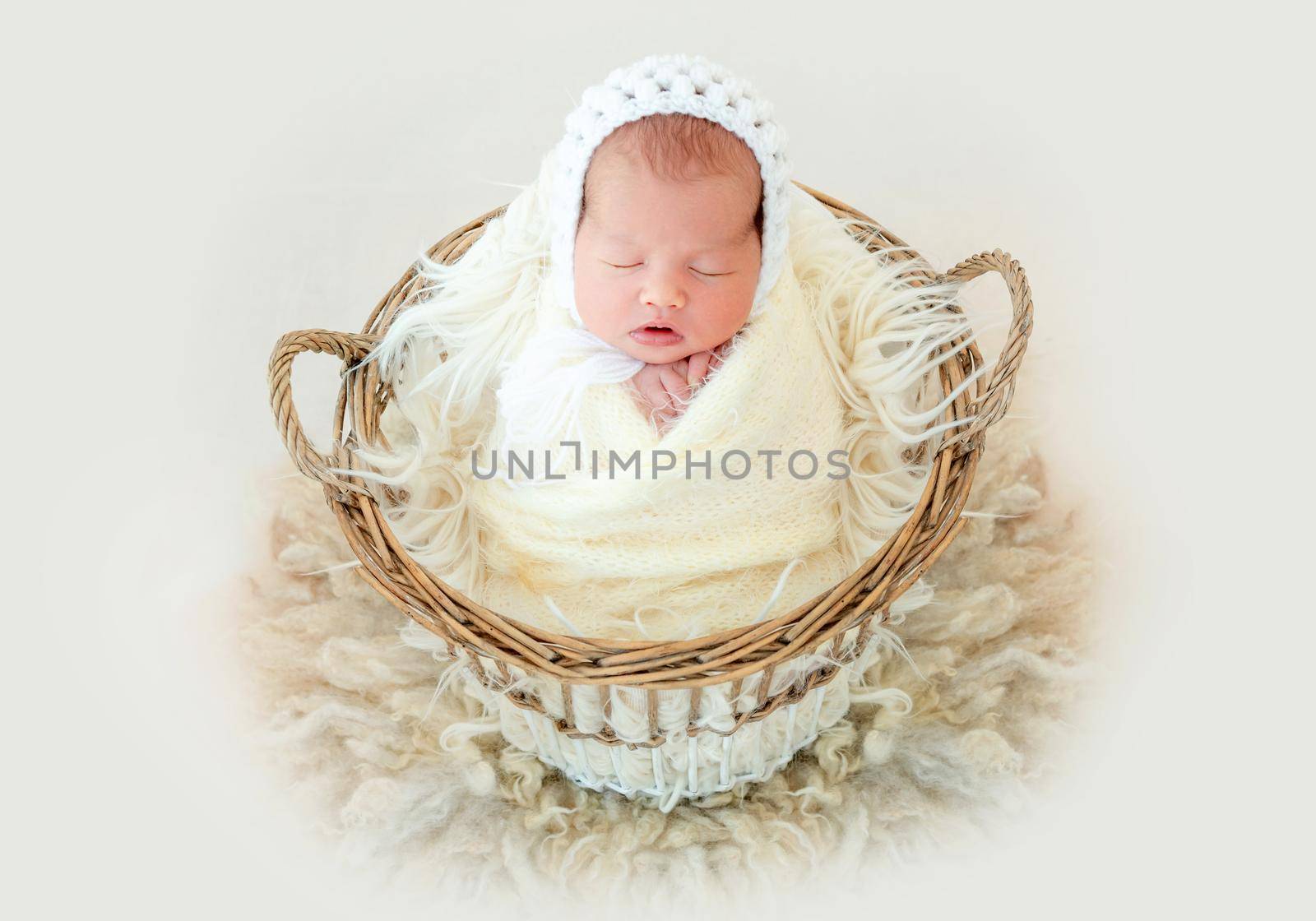 newborn baby girl sleeping sweetly in the basket