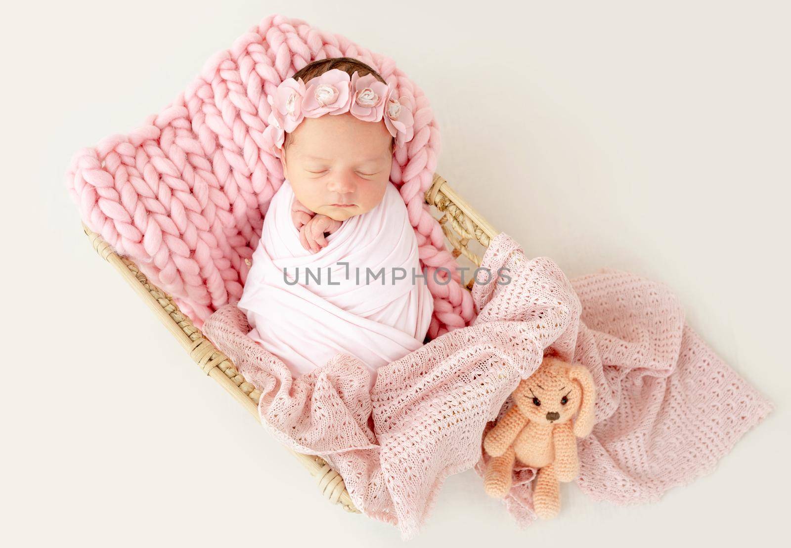 newborn baby girl sleeping sweetly in the basket