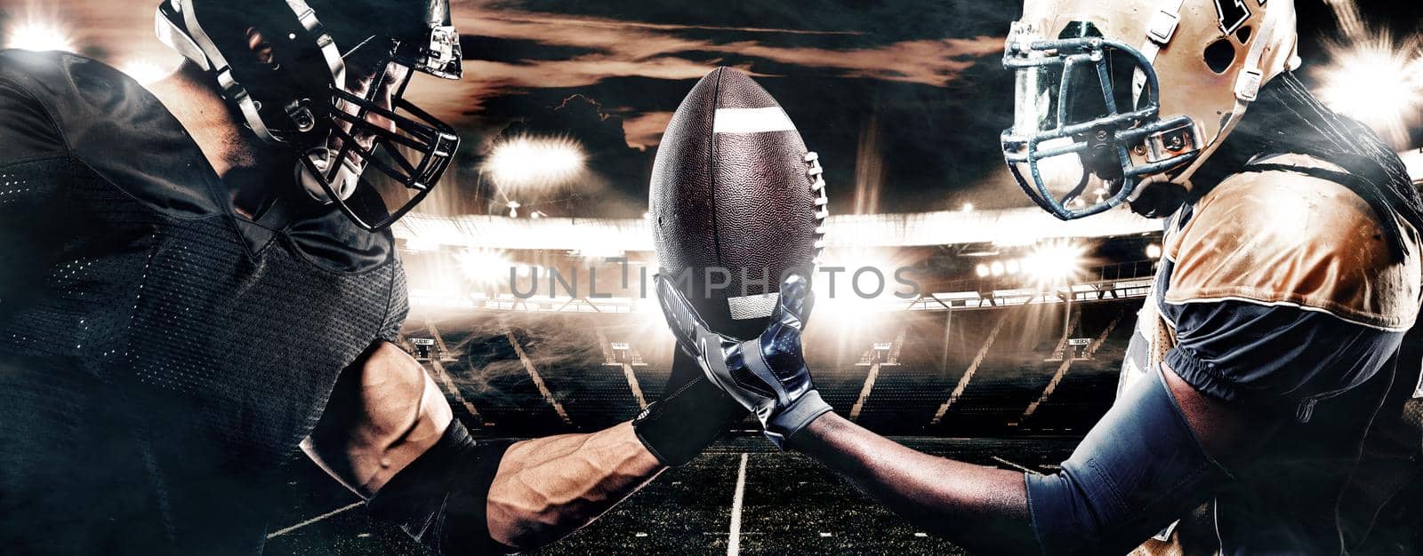 American Football player on stadium with smoke and lights.