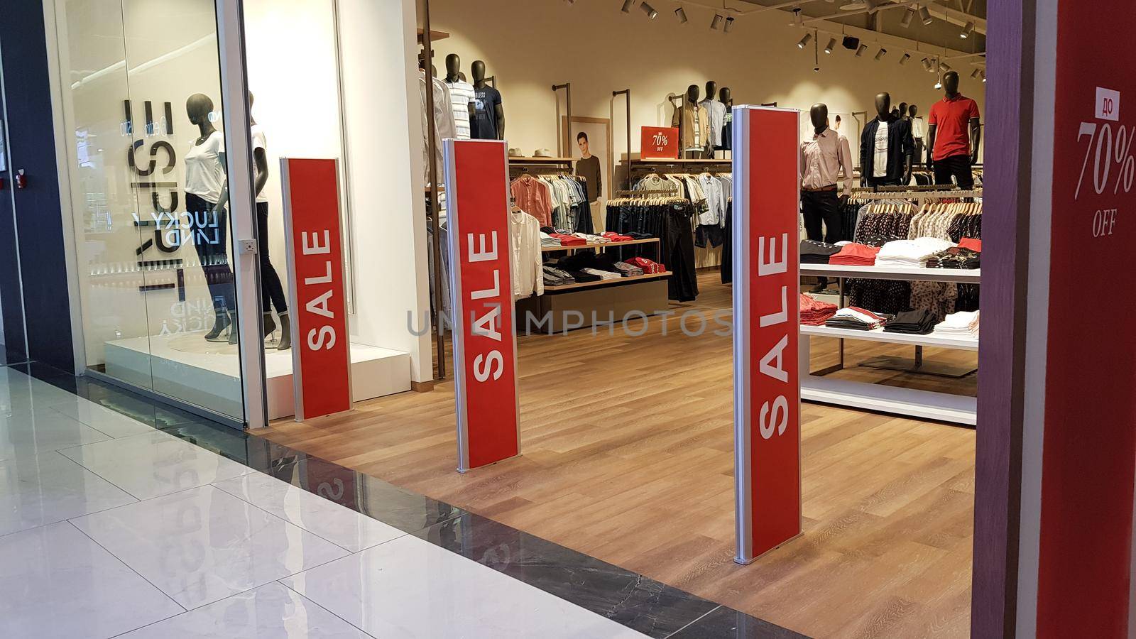 Ukraine, Kiev - September 04, 2019. Sale signs in a shop window in a shopping center on the day of shopping and the international holiday Black Friday, sale and discounts in clothing boutiques.