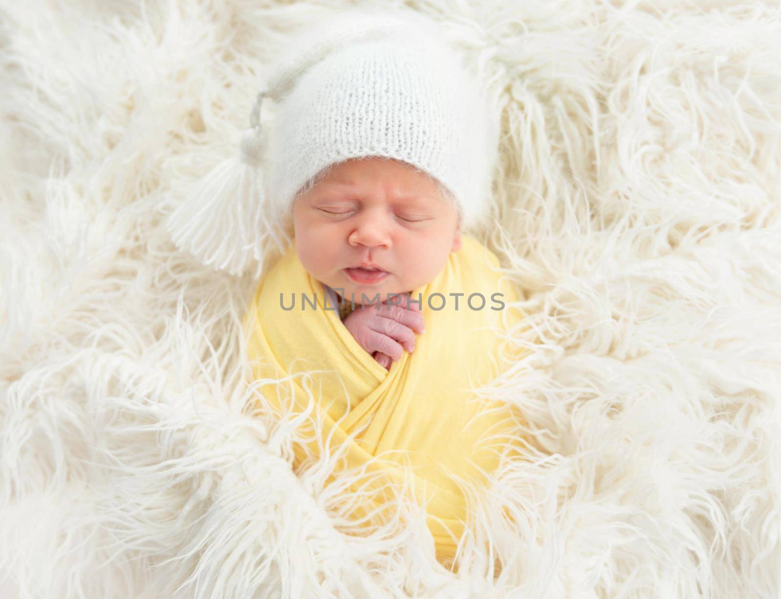 Cute newborn baby in knitted hat