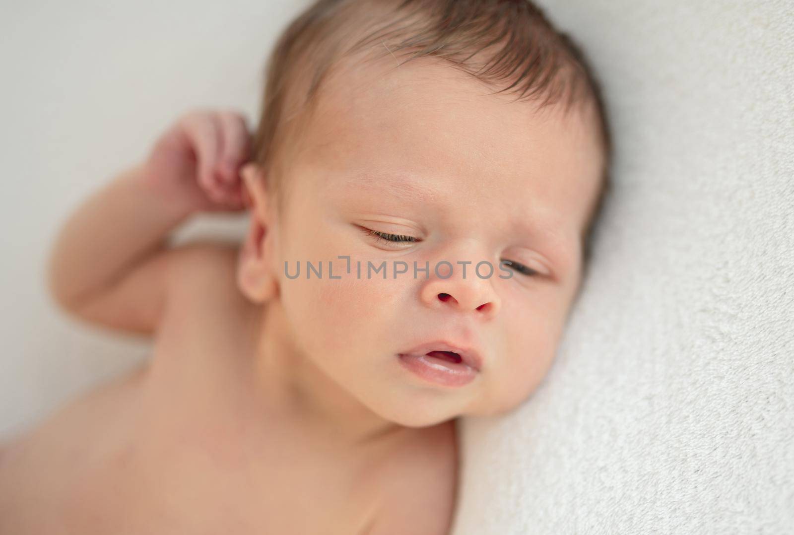 Portrait of innocent naked newborn