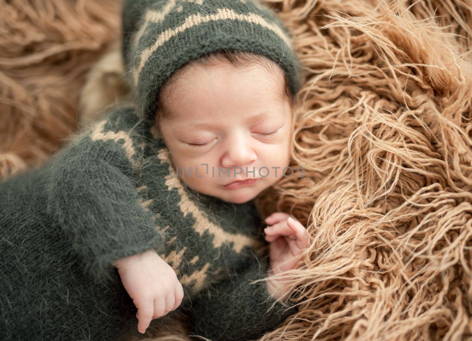 Cute newborn resting lying on side