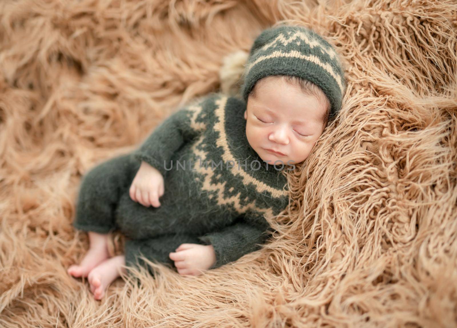 Cute newborn resting lying on side