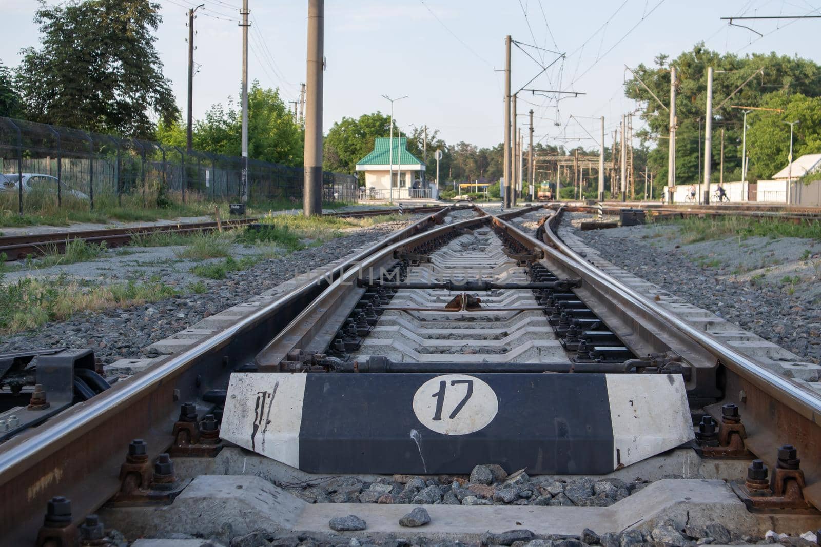 Abstract view of railway arrows. A turnout switch for rails in railway traffic. Rails, sleepers and crushed stone on the railway track. Switching transitions