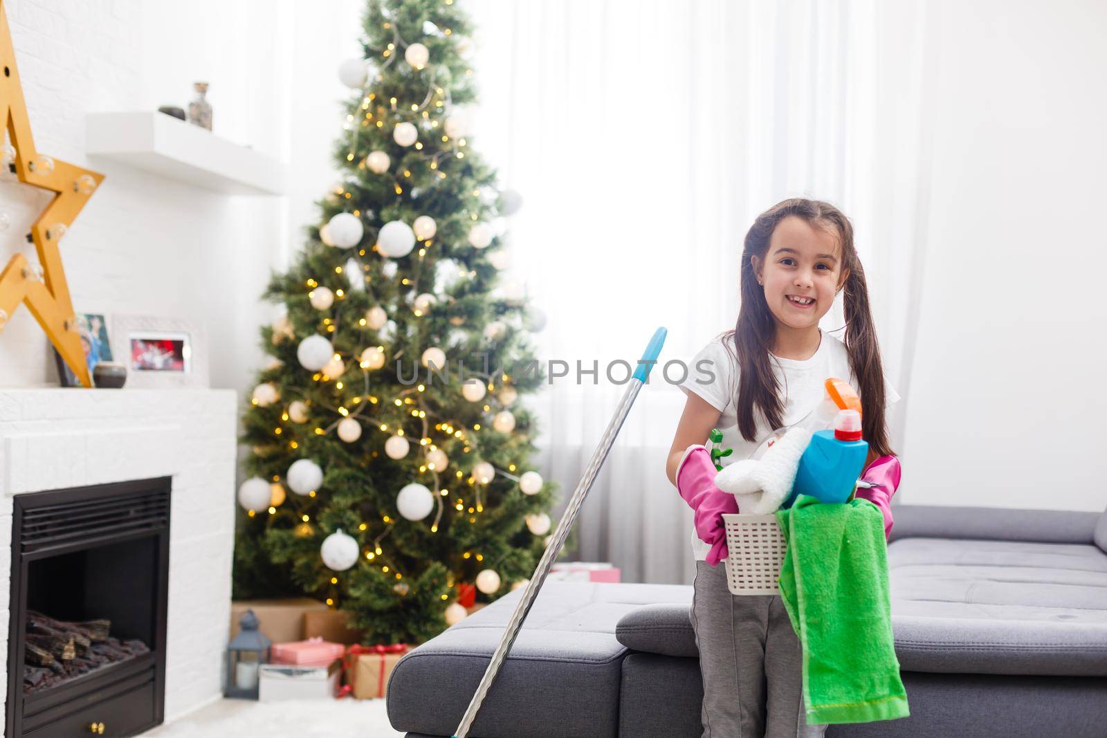 little girl cleaning the apartment before christmas