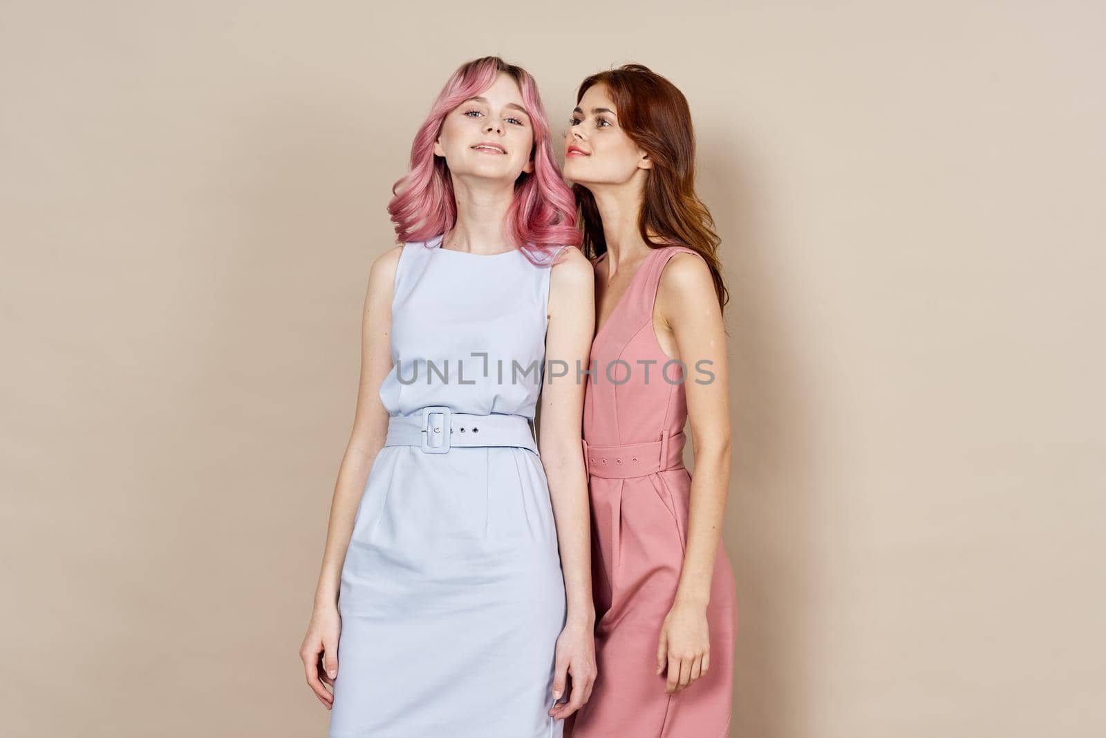 two women in fashionable clothes posing model decoration. High quality photo