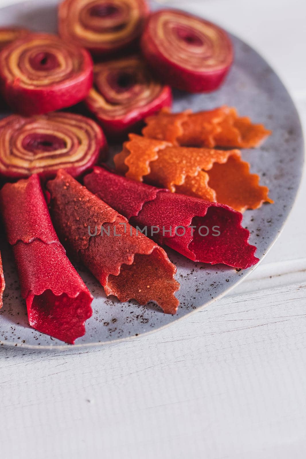 Fruit rolls pastille. Apple candy rolls, chips. Shredded and dried fruits. Useful sweetness. Food dessert. Homemade snack. Degidrated fruits. Natural and healthy, Sugar-Free, nutrition.