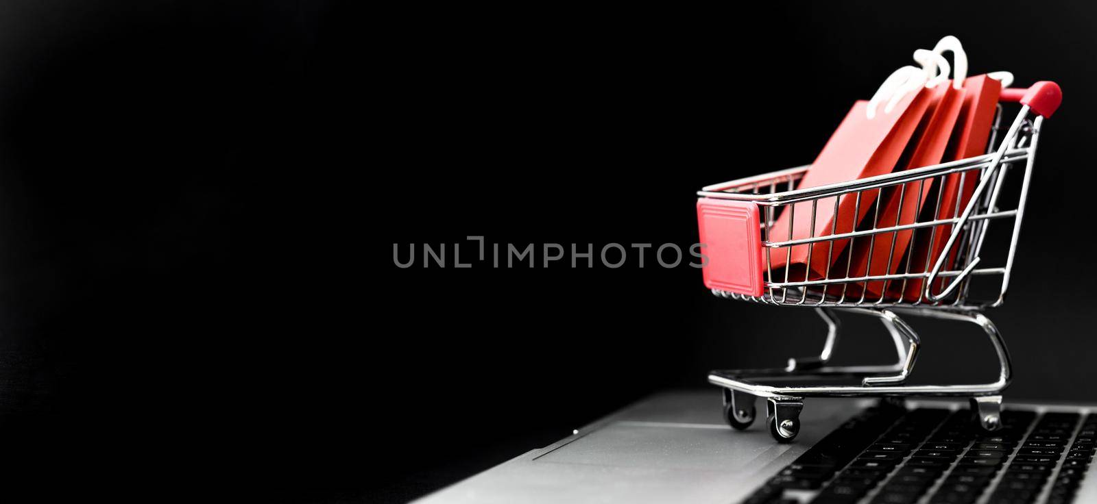 front view cyber monday shopping cart with bags copy space