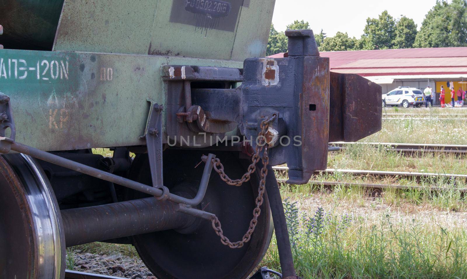 Train carriage on rails. Outdated technology for joining freight train wagons. Oil cargo hitch body for docking. A rail car coupling that connects it to other carriages on the train