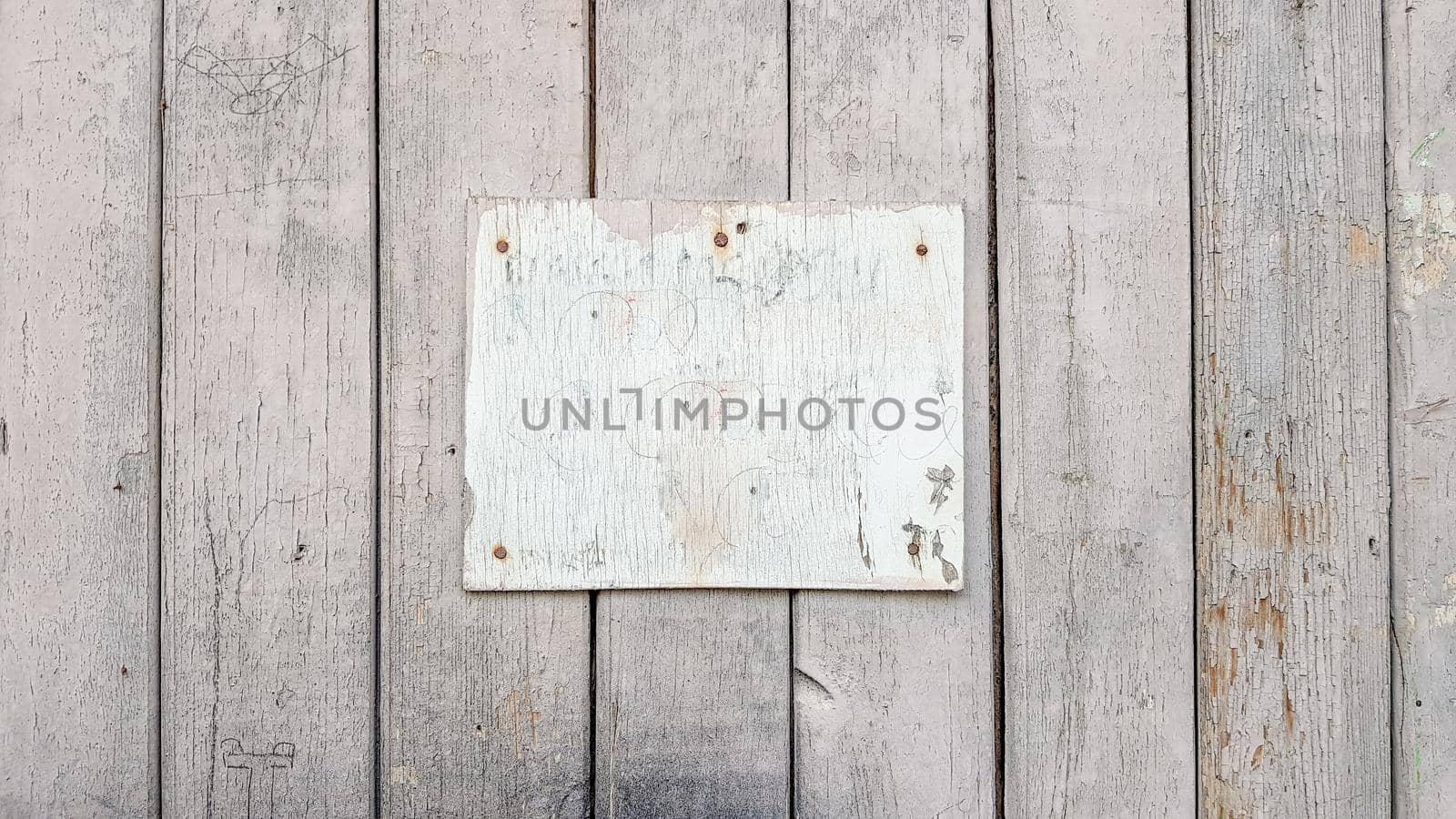 Sign boards on a rustic wooden wall mockup. vintage frames on an old wooden wall. Gray wooden background texture with copy space. wall wood table
